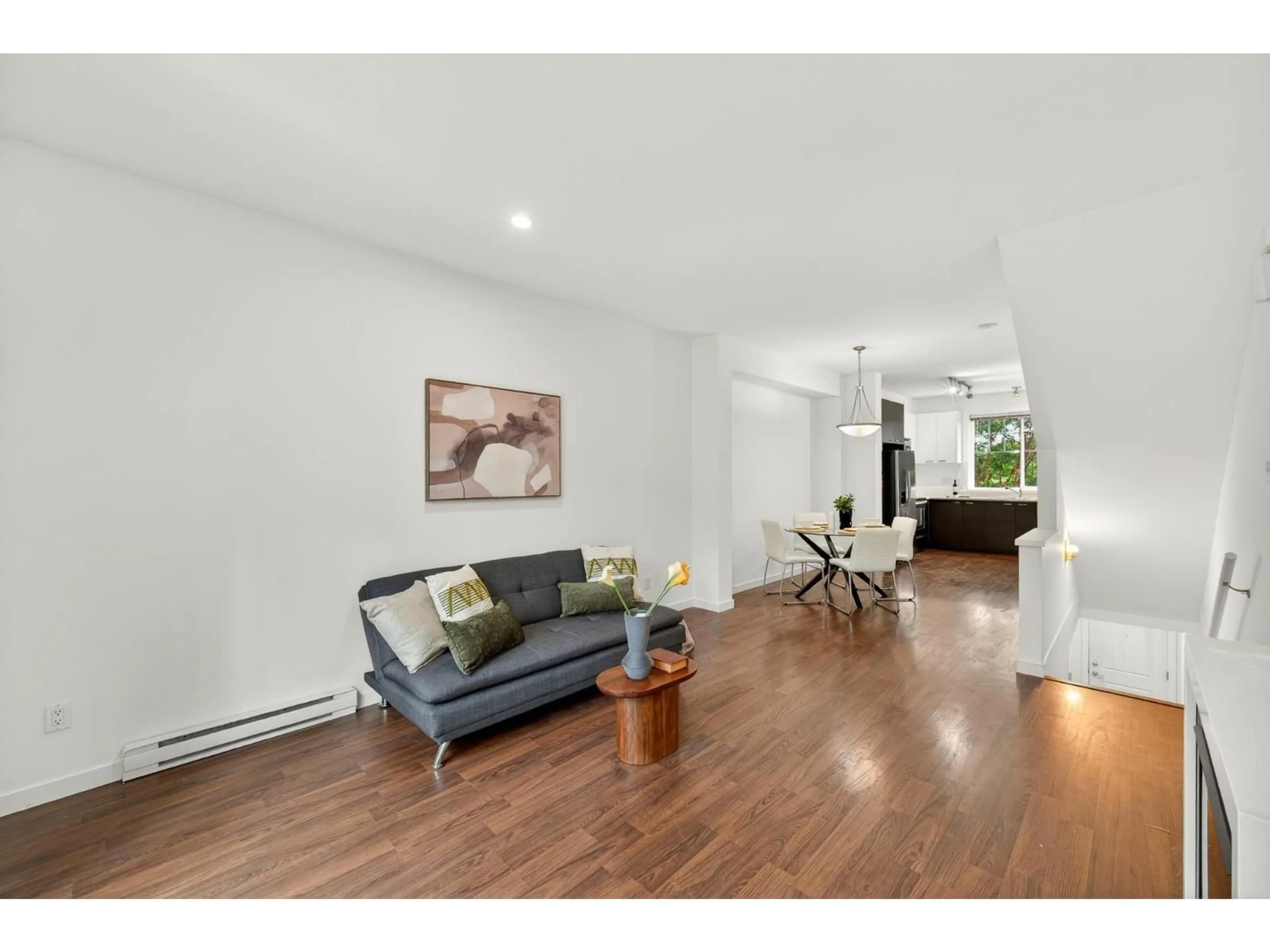 Living room with furniture, wood/laminate floor for 4 - 7348 192A STREET, Surrey British Columbia V4N6J2