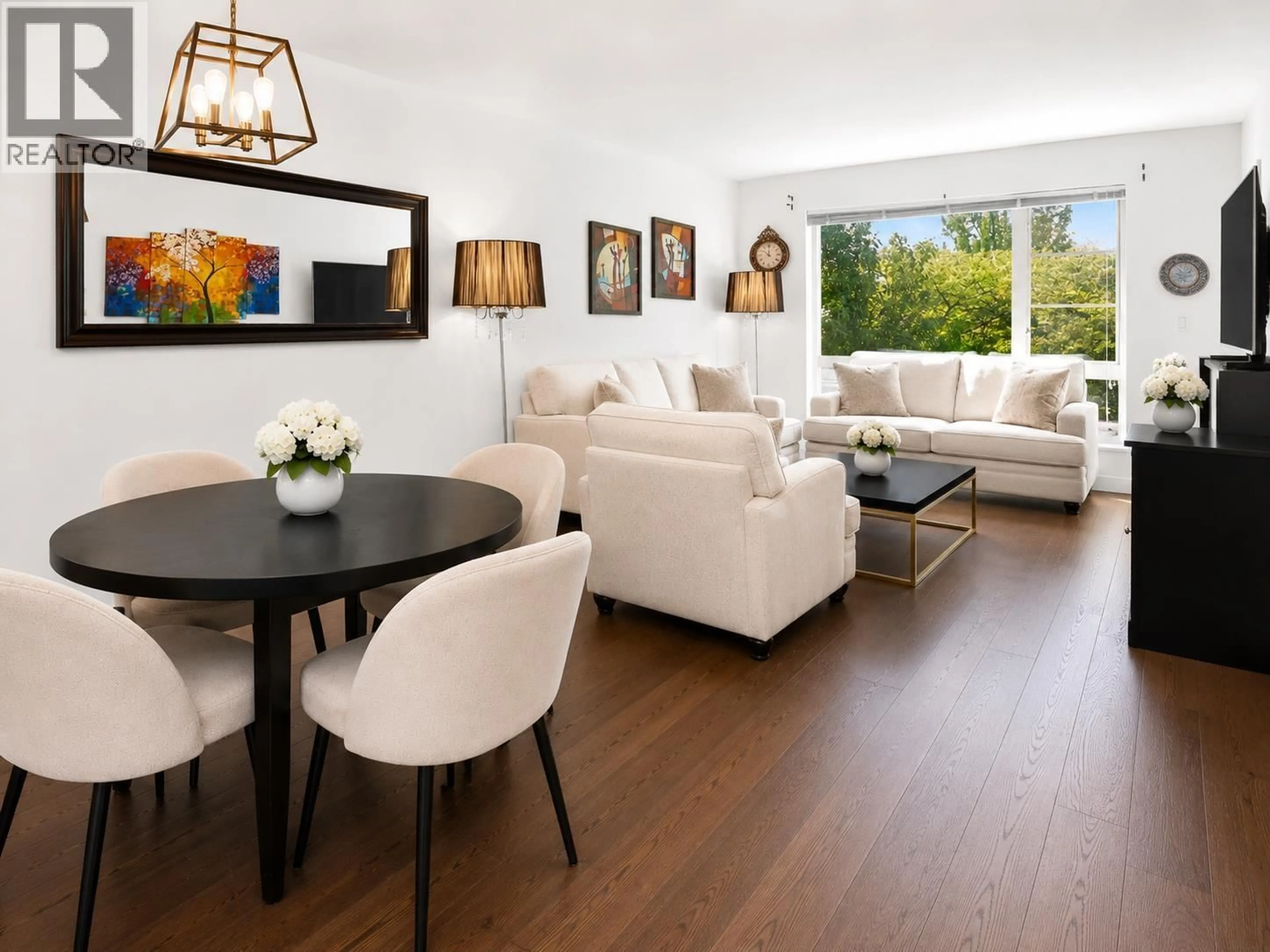 Living room with furniture, wood/laminate floor for 201 - 1330 MARINE DRIVE, North Vancouver British Columbia V7P1T4