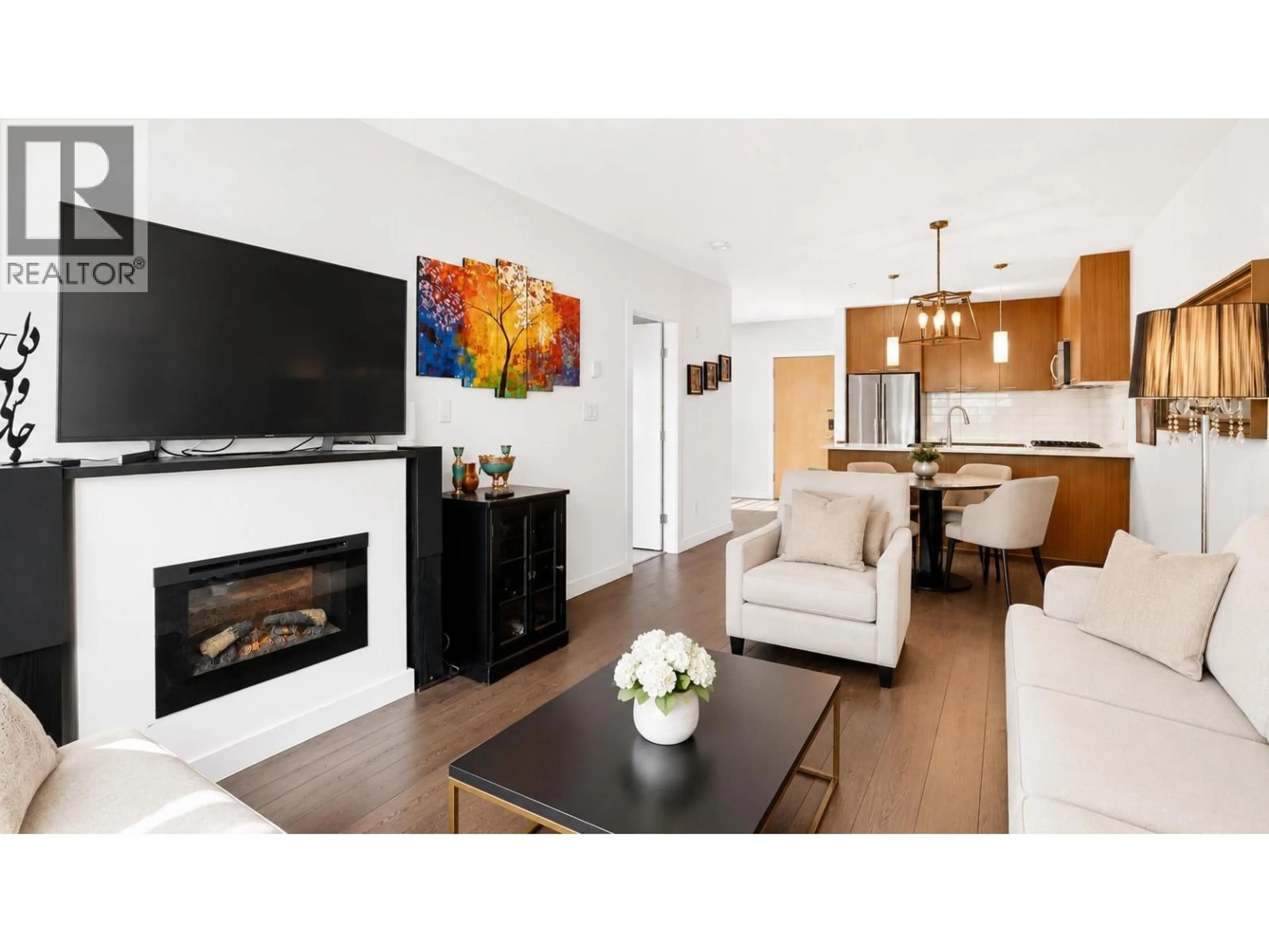 Living room with furniture, wood/laminate floor for 201 - 1330 MARINE DRIVE, North Vancouver British Columbia V7P1T4