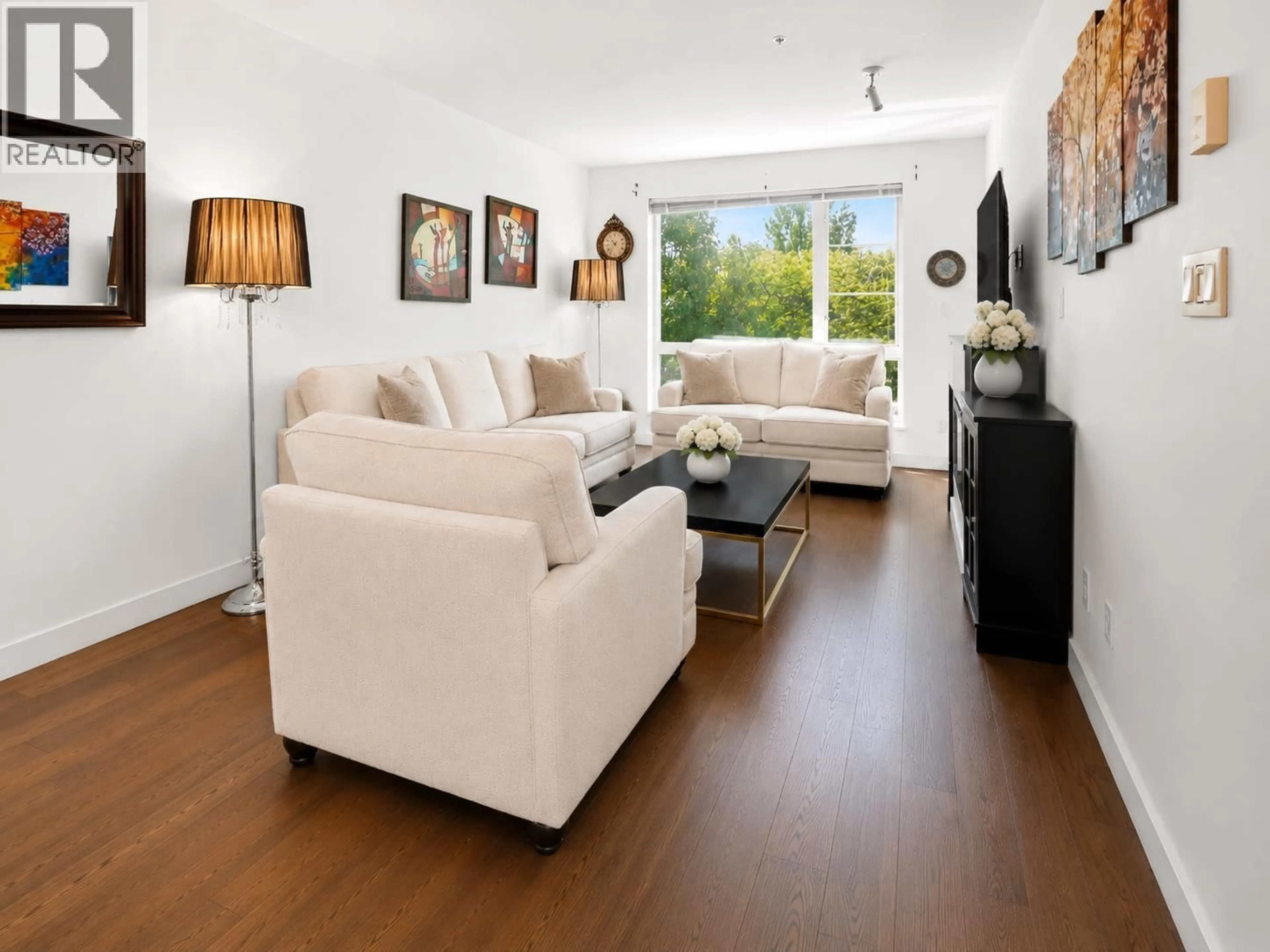 Living room with furniture, wood/laminate floor for 201 - 1330 MARINE DRIVE, North Vancouver British Columbia V7P1T4