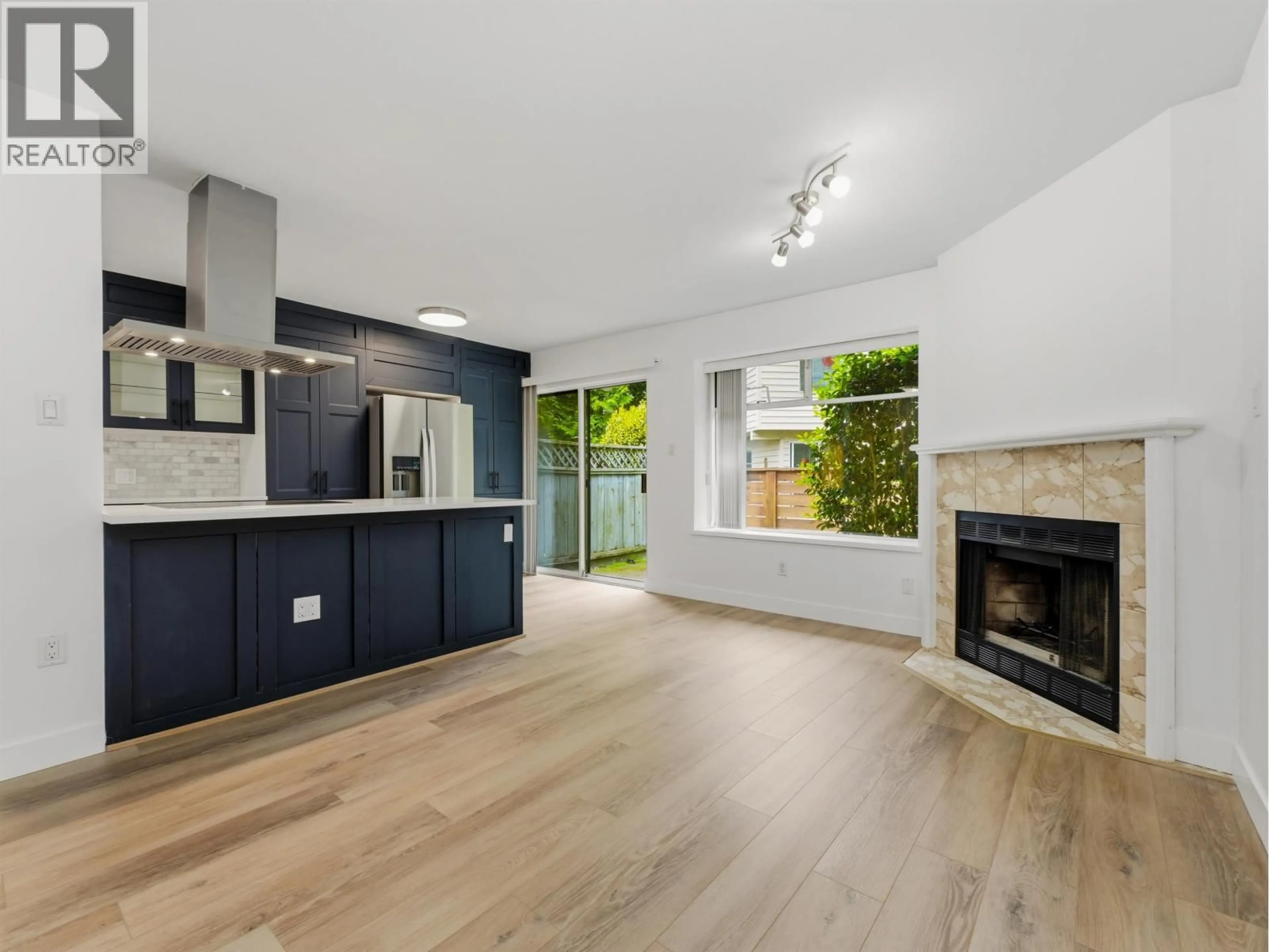 Open concept kitchen, wood/laminate floor for 3 - 7691 MOFFATT ROAD, Richmond British Columbia V6Y1X9