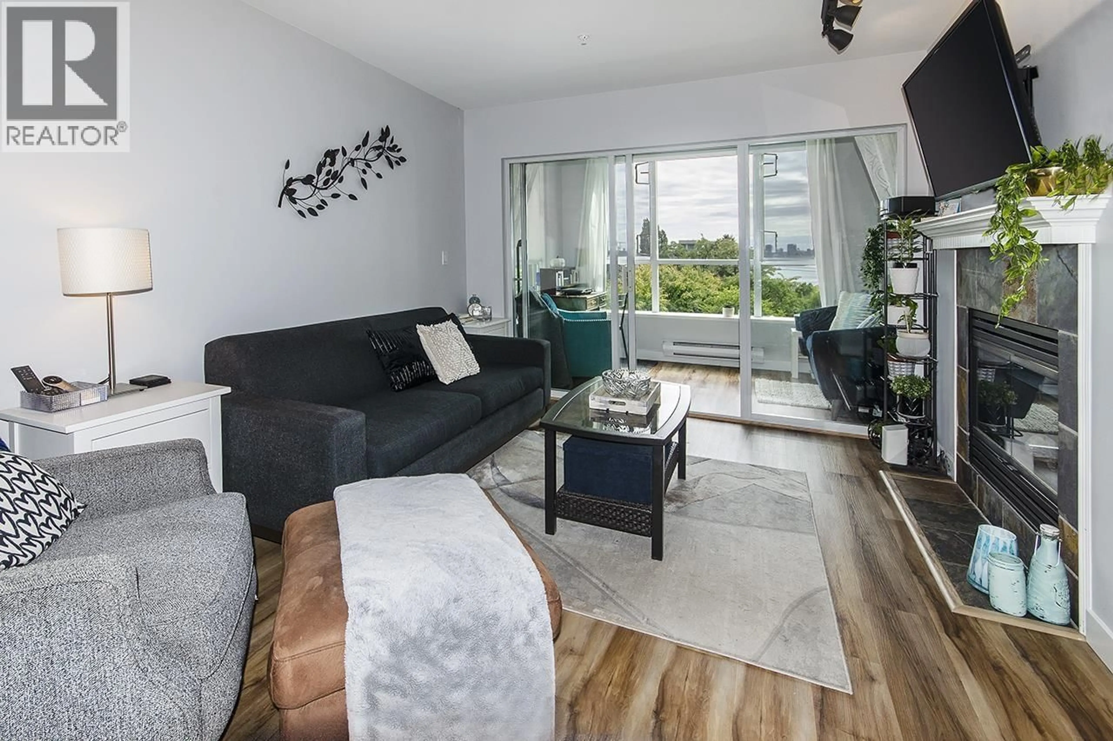 Living room with furniture, wood/laminate floor for 305 - 155 3RD STREET, North Vancouver British Columbia V7L1E5