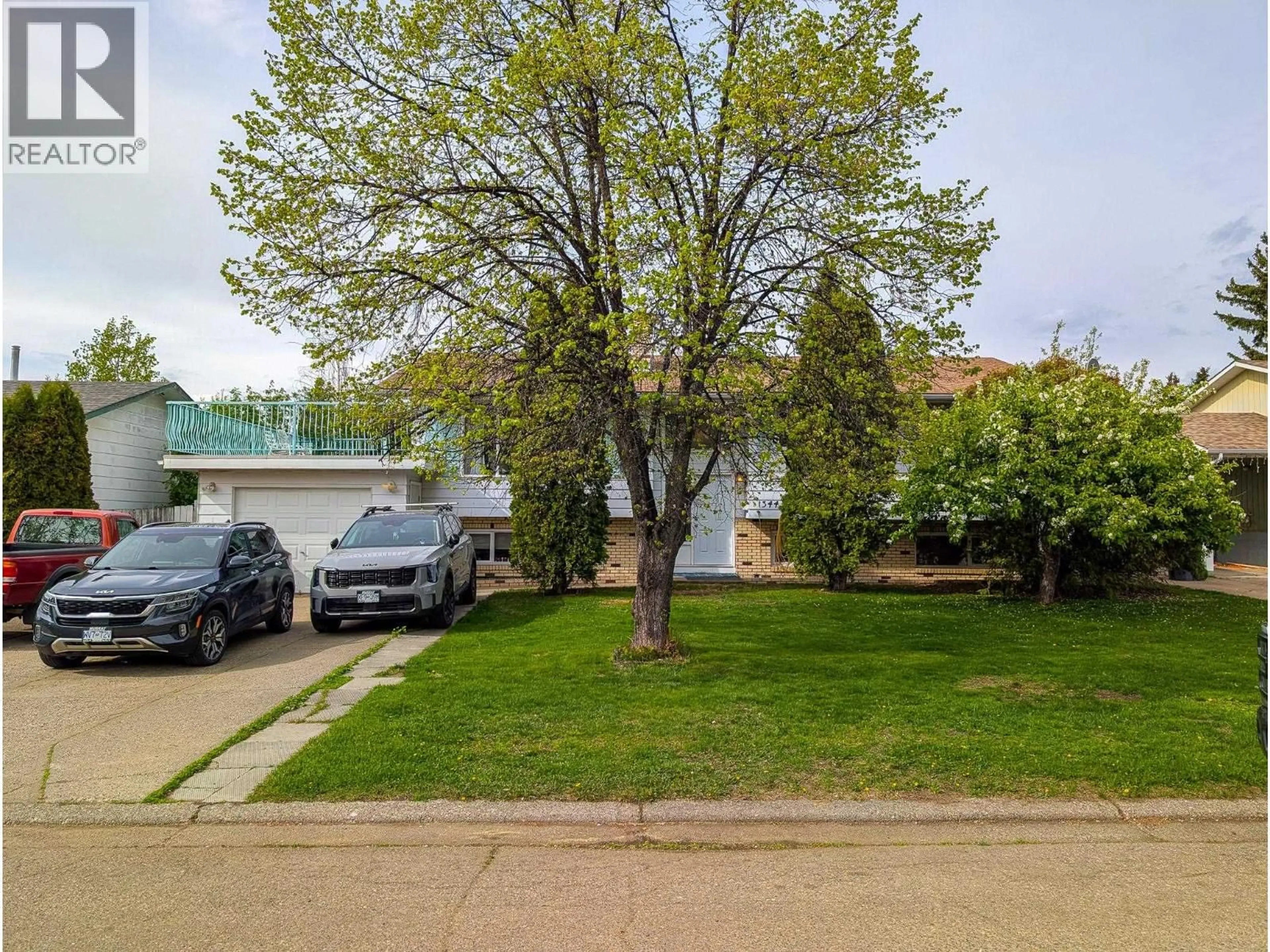 A pic from outside/outdoor area/front of a property/back of a property/a pic from drone, street for 1344 EAGLET CRESCENT, Prince George British Columbia V2M4H7