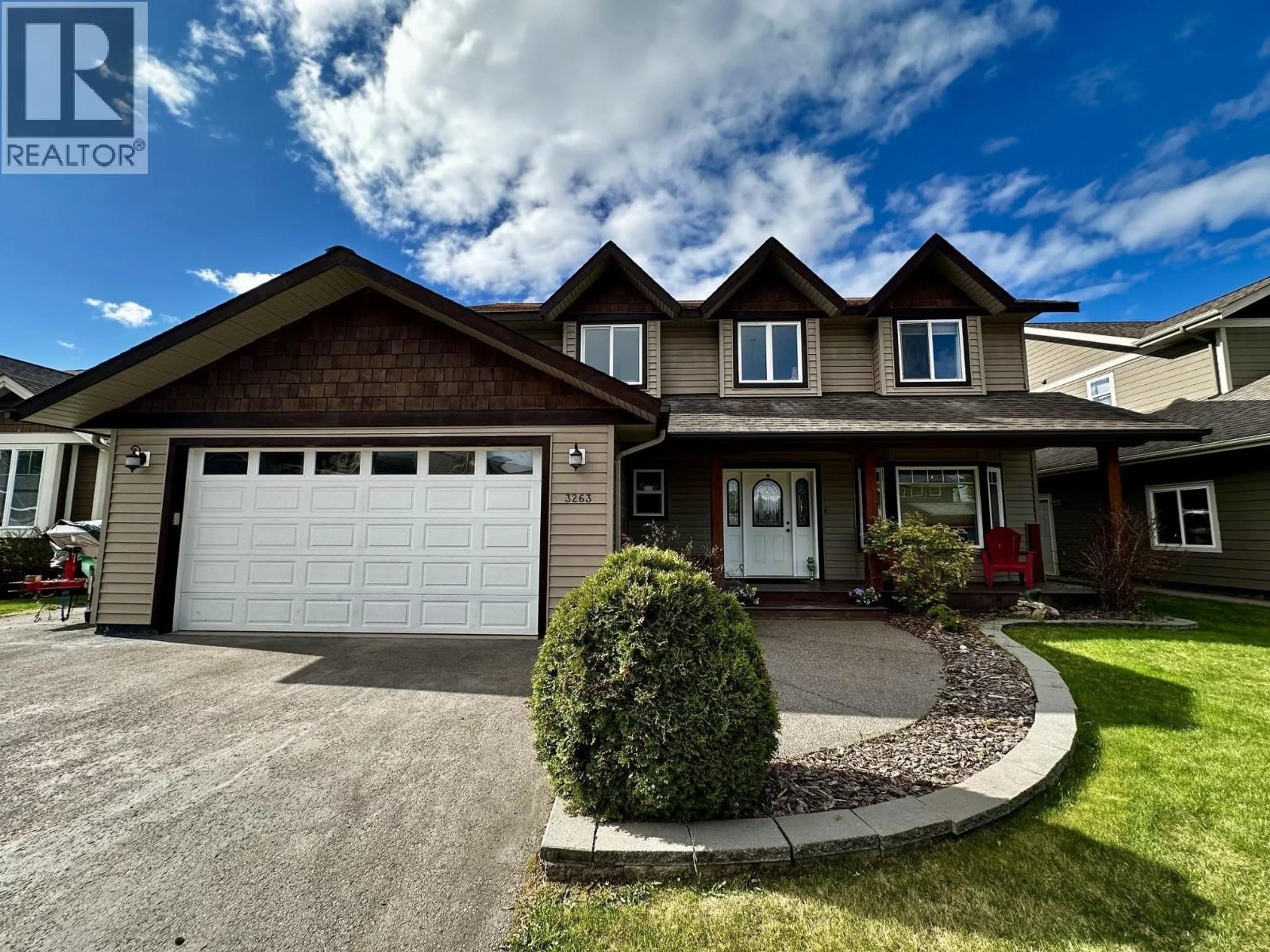 Home with vinyl exterior material, street for 3263 THIRD AVENUE, Smithers British Columbia V0J2N0