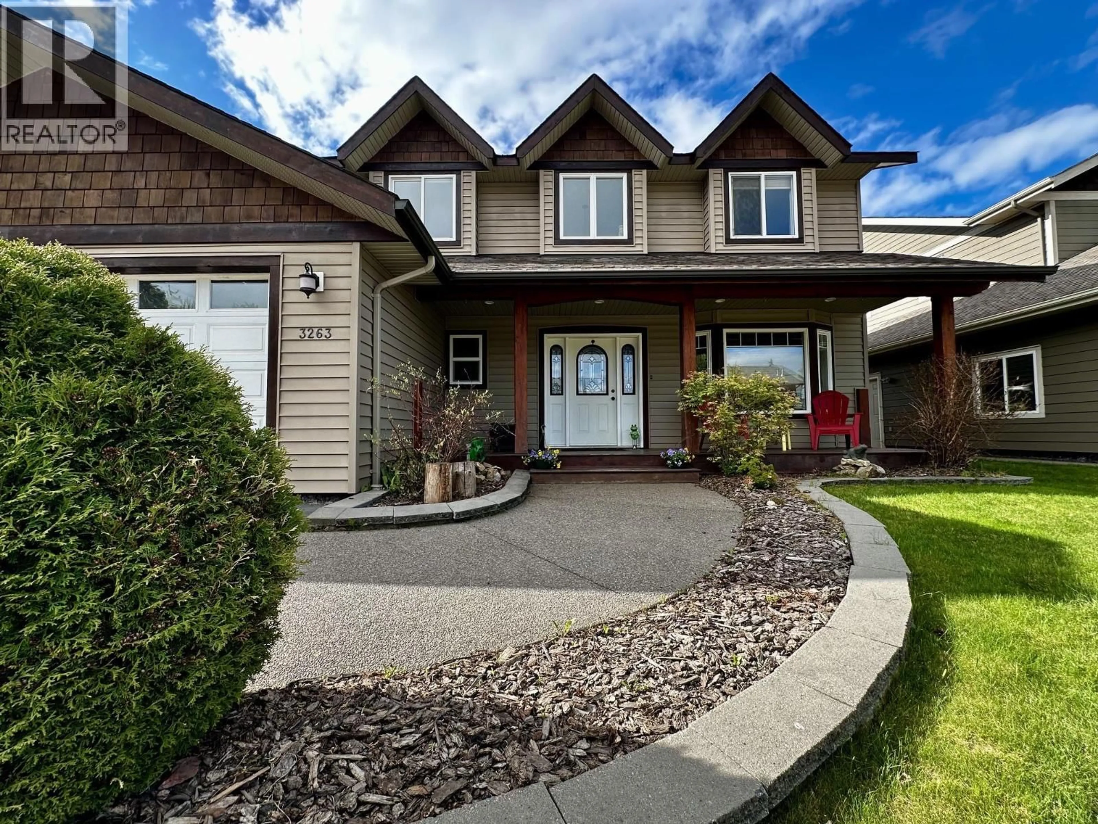 Home with vinyl exterior material, street for 3263 THIRD AVENUE, Smithers British Columbia V0J2N0