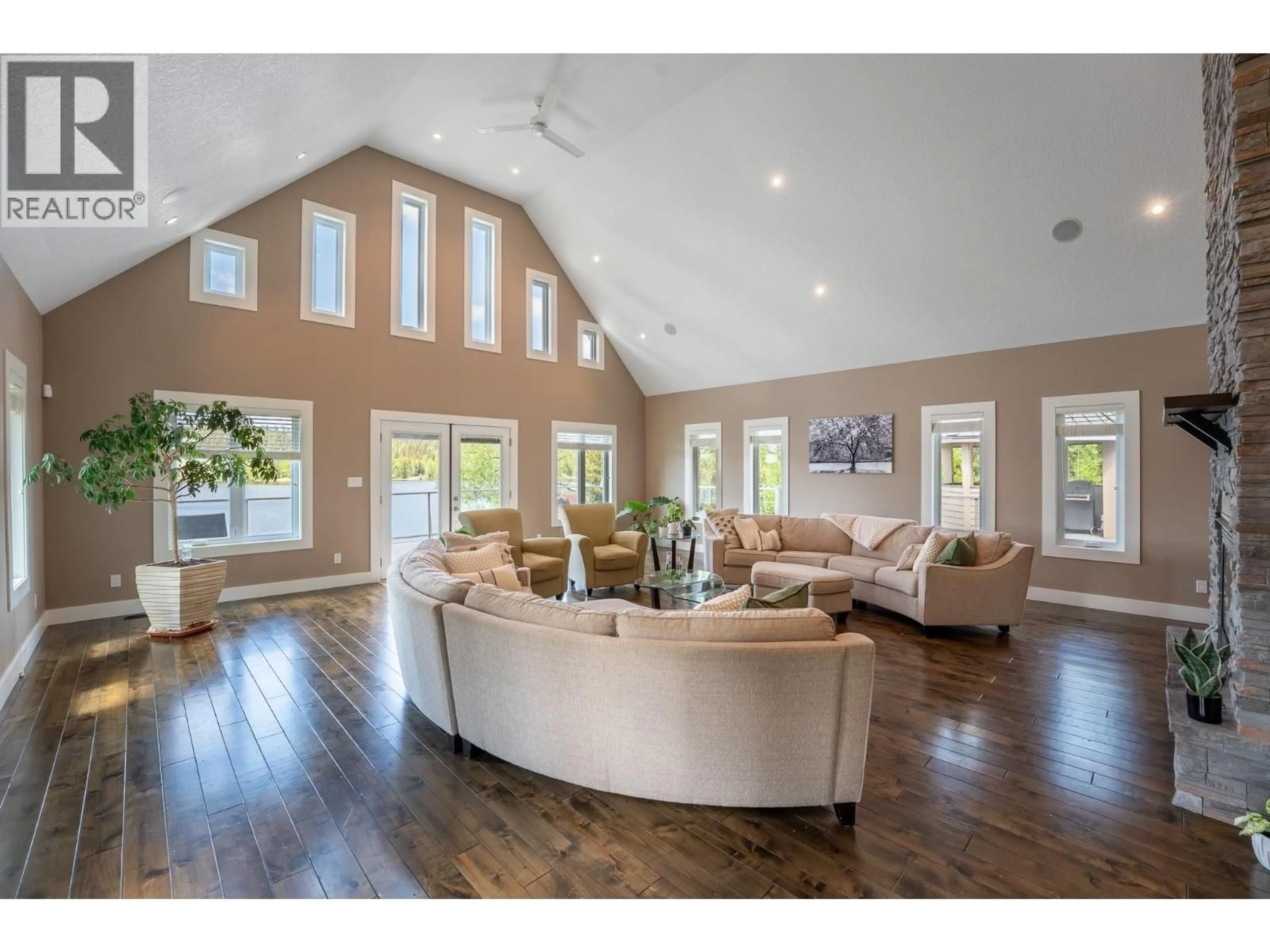 Living room with furniture, wood/laminate floor for 21565 WEST LAKE ROAD, Prince George British Columbia V2N6H5