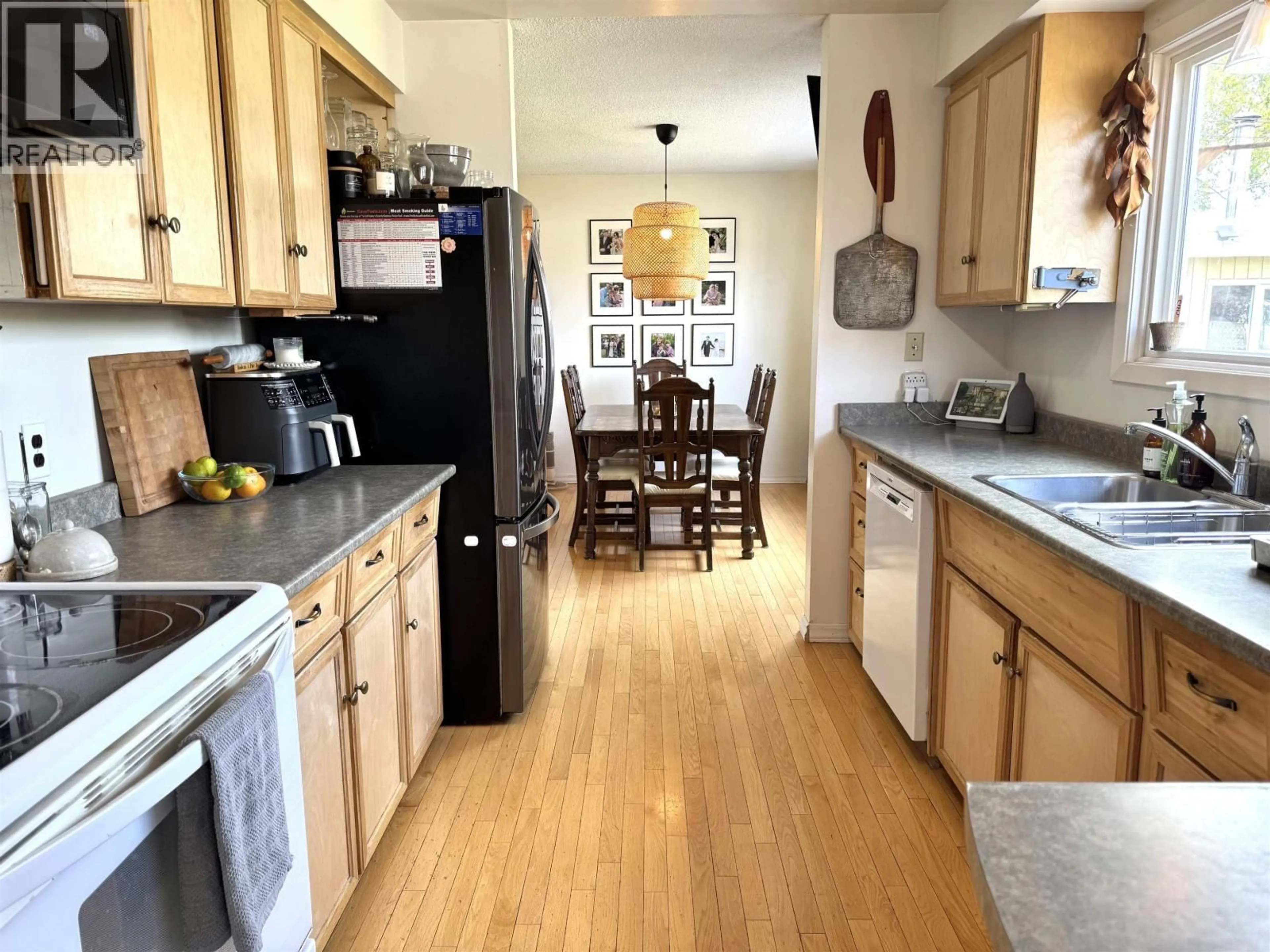 Open concept kitchen, wood/laminate floor for 4168 BROADWAY AVENUE, Smithers British Columbia V0J2N0
