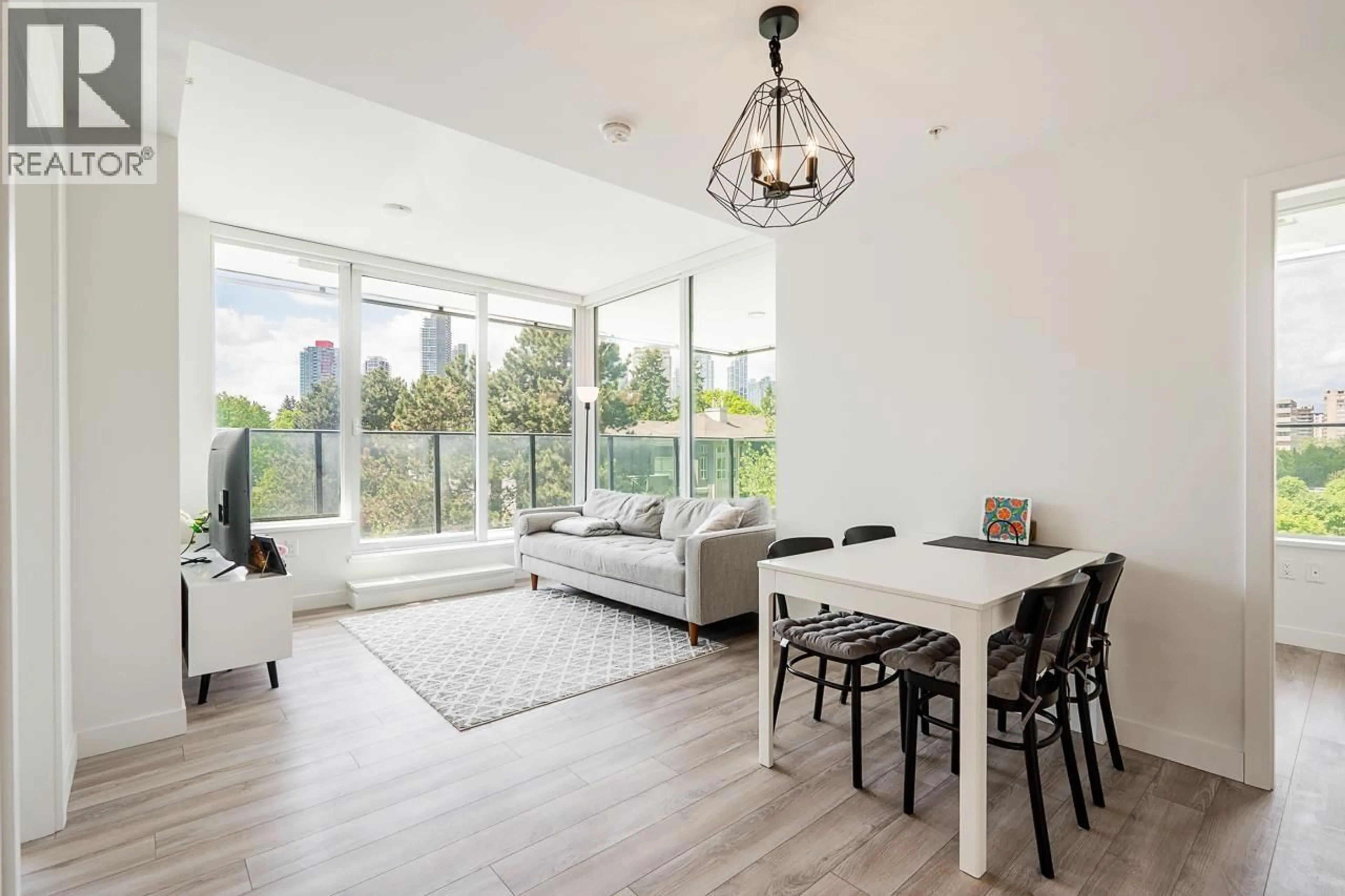 Living room with furniture, wood/laminate floor for 301 - 6699 DUNBLANE AVENUE, Burnaby British Columbia V5H0J8