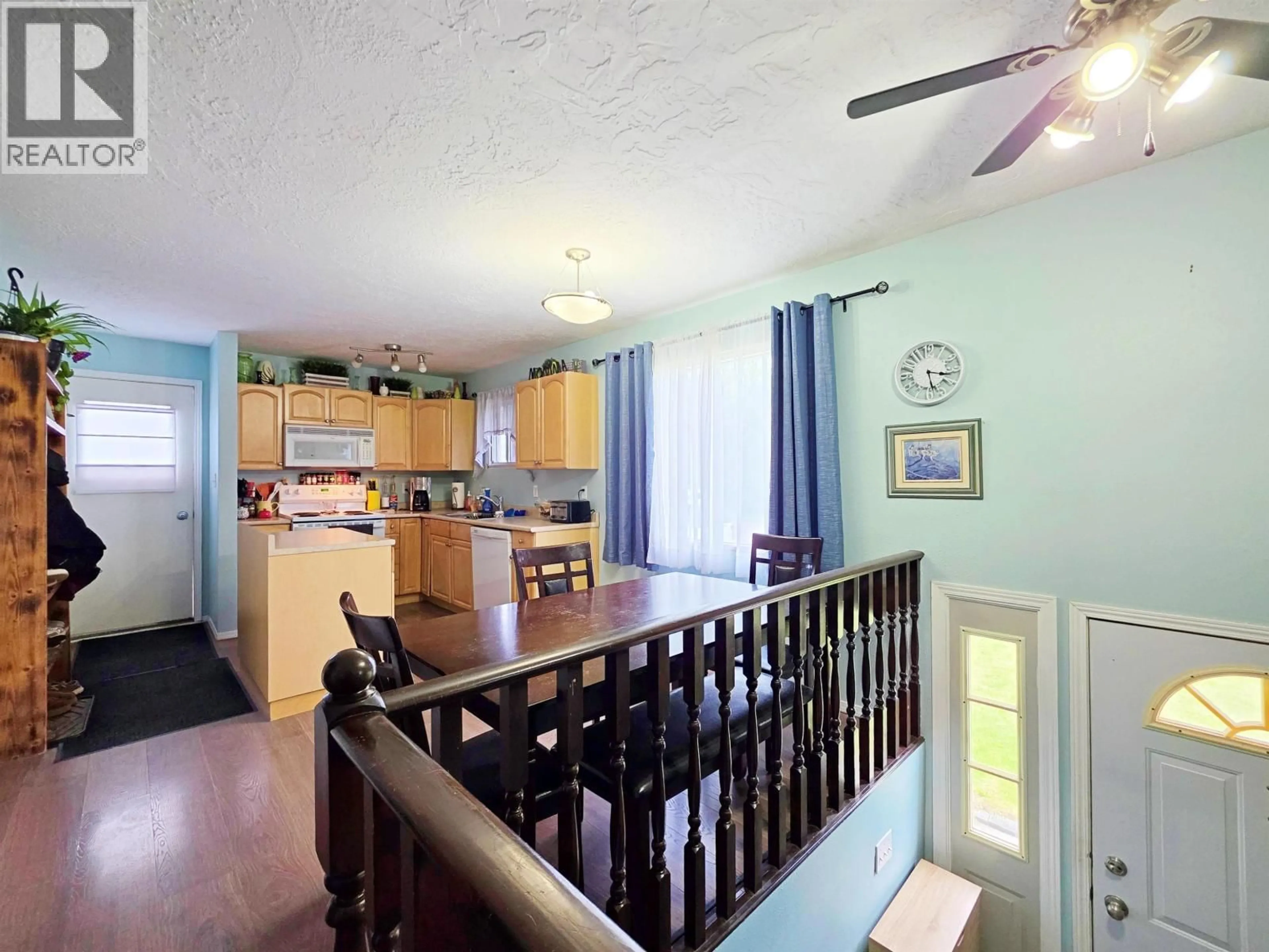 Open concept kitchen, wood/laminate floor for 531 NORMAN STREET, Quesnel British Columbia V2J3R7