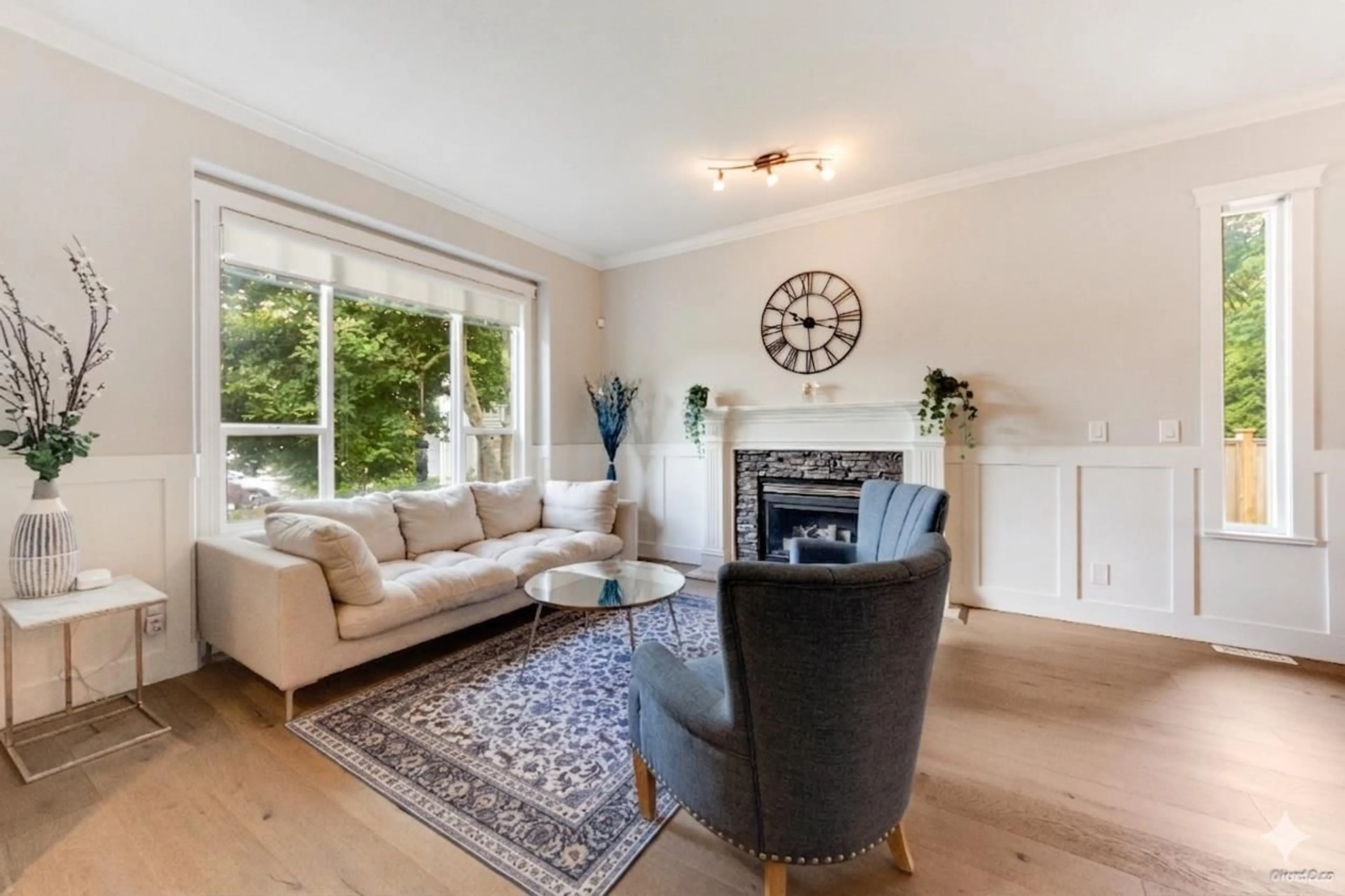 Living room with furniture, wood/laminate floor for 6928 182A STREET, Surrey British Columbia V3S9H4