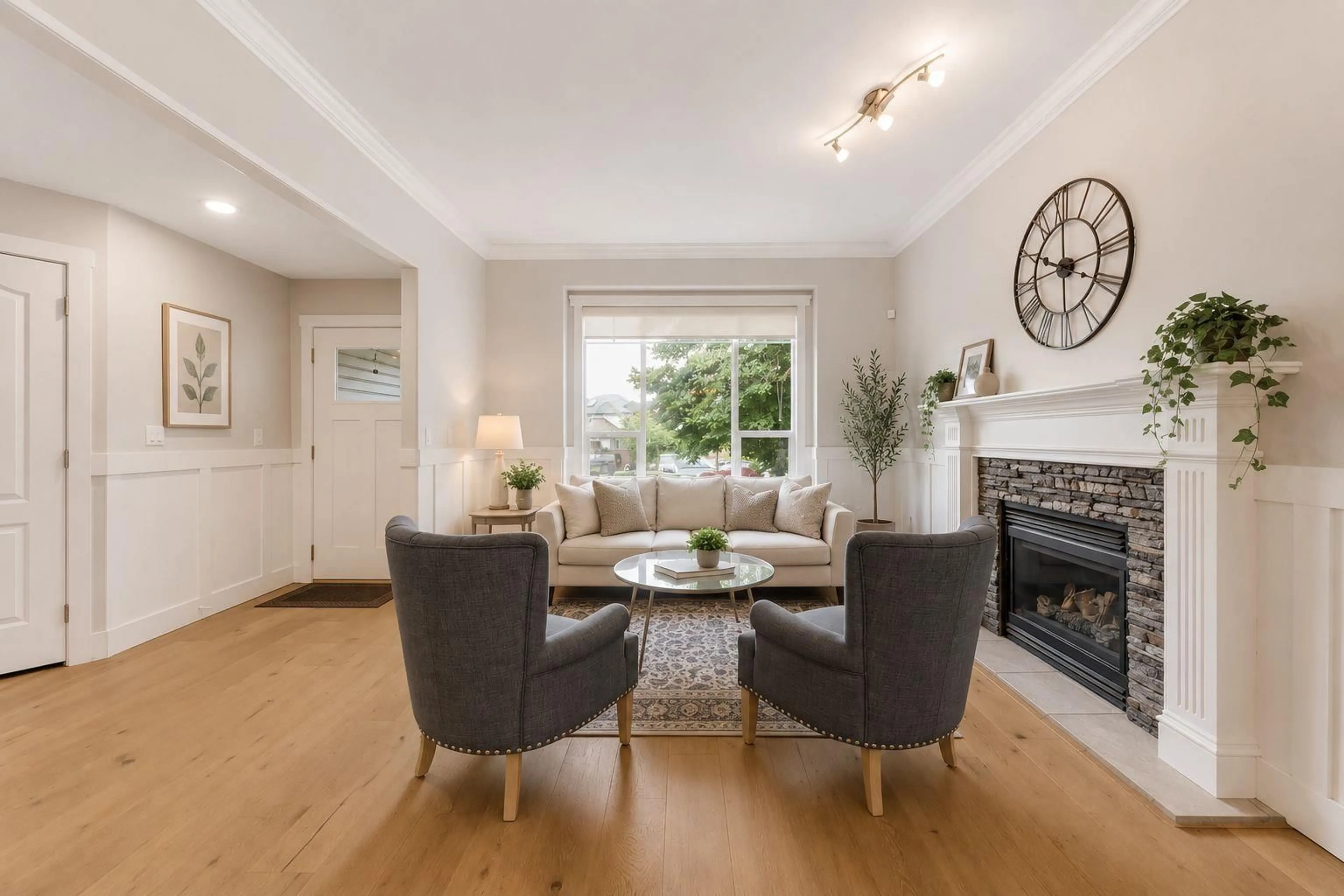 Living room with furniture, wood/laminate floor for 6928 182A STREET, Surrey British Columbia V3S9H4