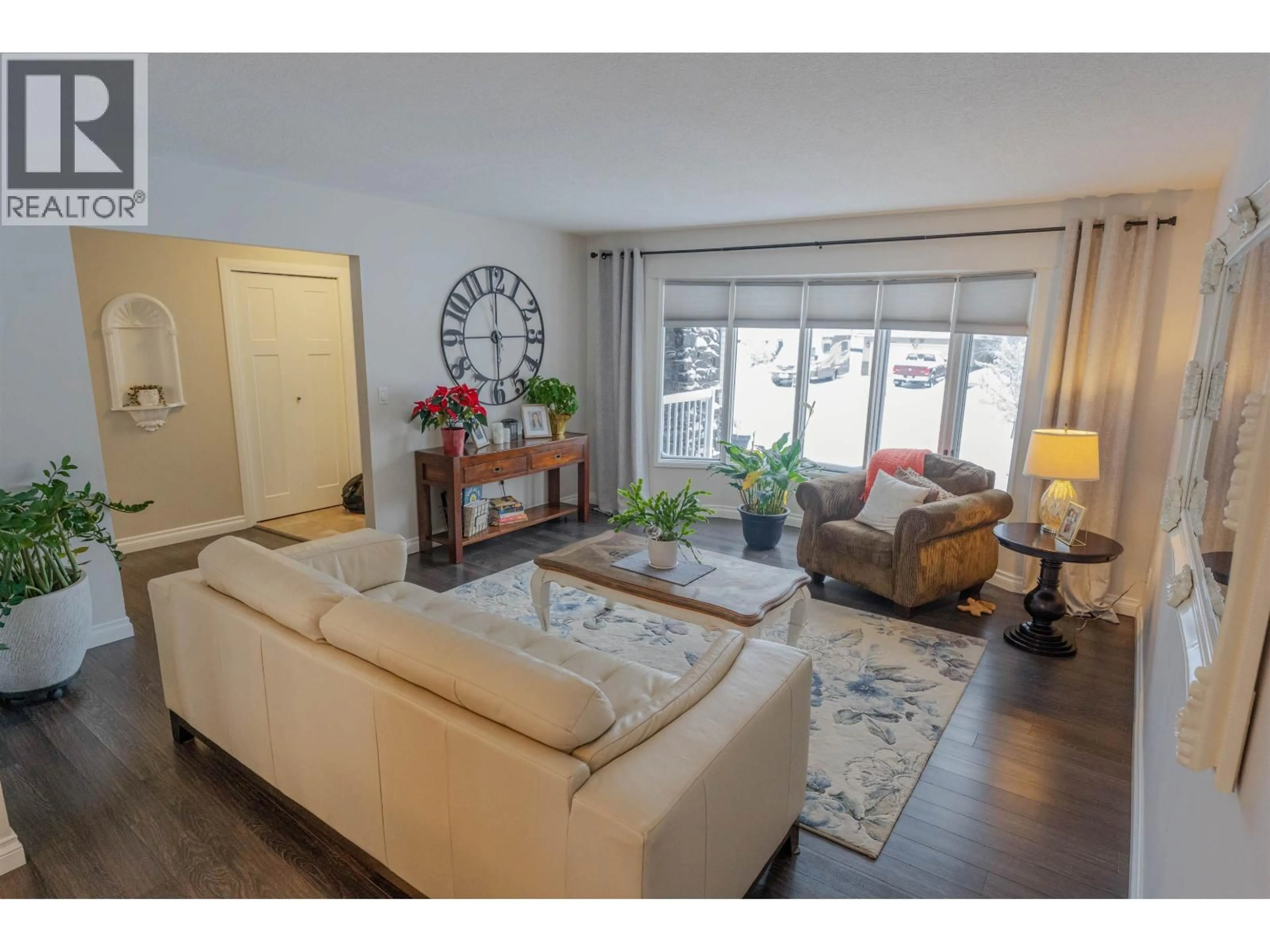 Living room with furniture, wood/laminate floor for 10515 114 AVENUE, Fort St. John British Columbia V1J6H7