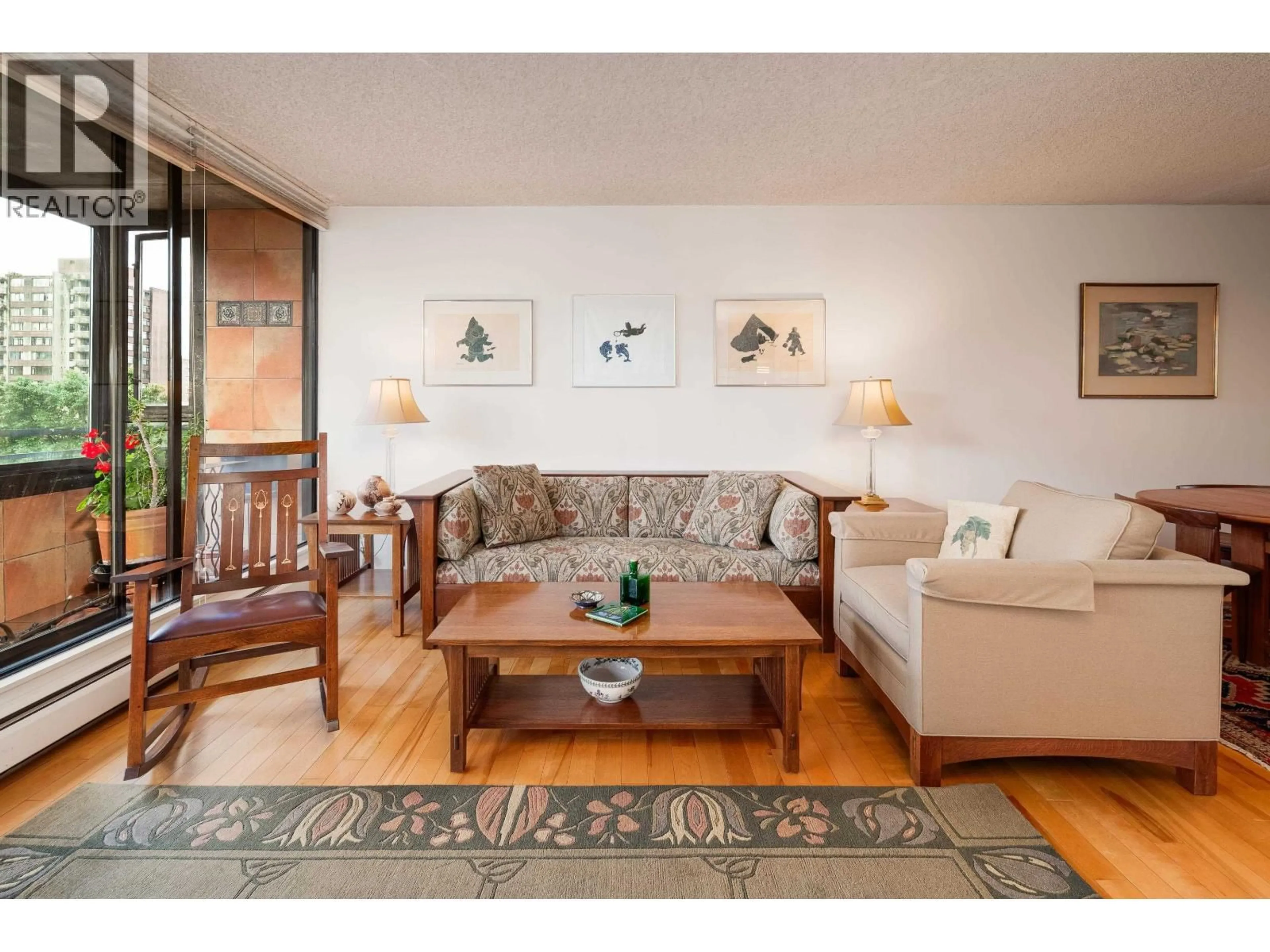 Living room with furniture, wood/laminate floor for 602 - 1816 HARO STREET, Vancouver British Columbia V6G2Y7