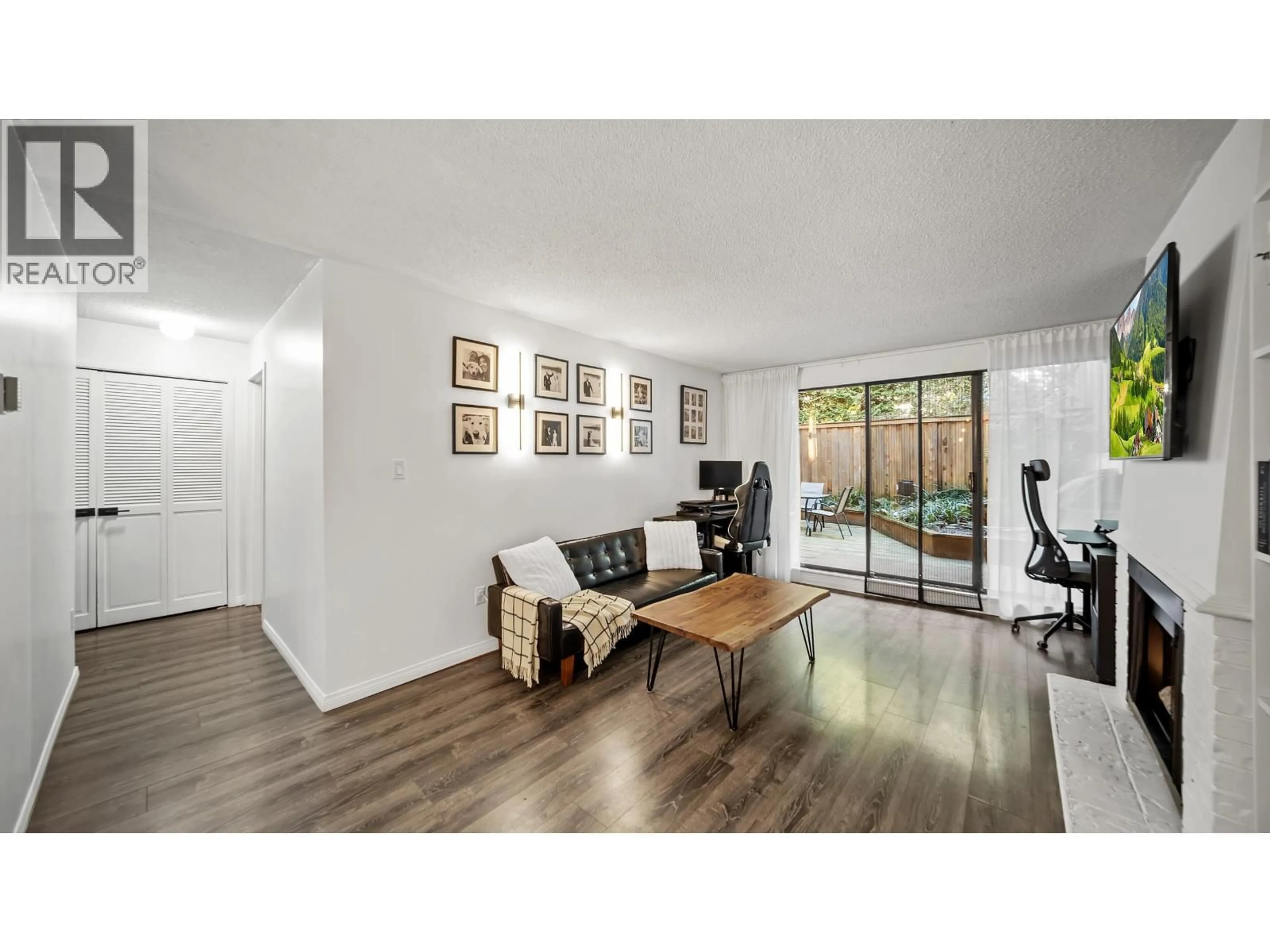 Living room with furniture, wood/laminate floor for 214 - 5340 HASTINGS STREET, Burnaby British Columbia V5B1R1
