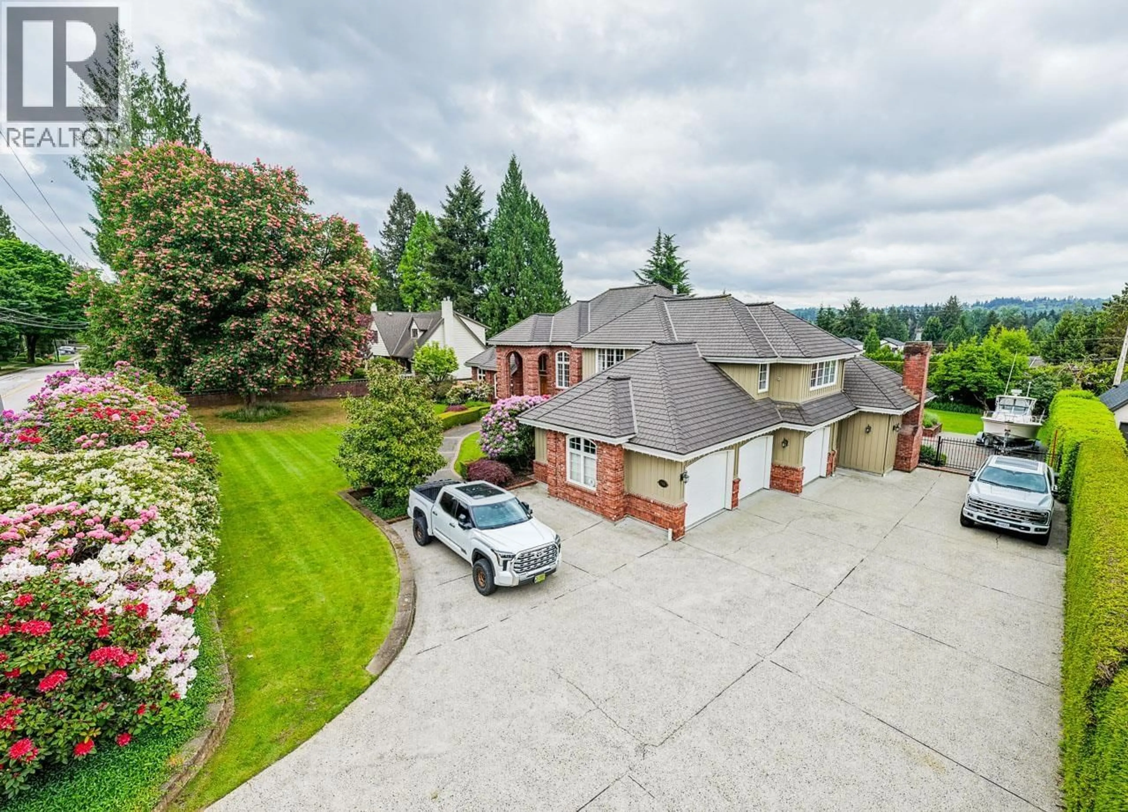 A pic from outside/outdoor area/front of a property/back of a property/a pic from drone, street for 7976 GOVERNMENT ROAD, Burnaby British Columbia V5A2E2