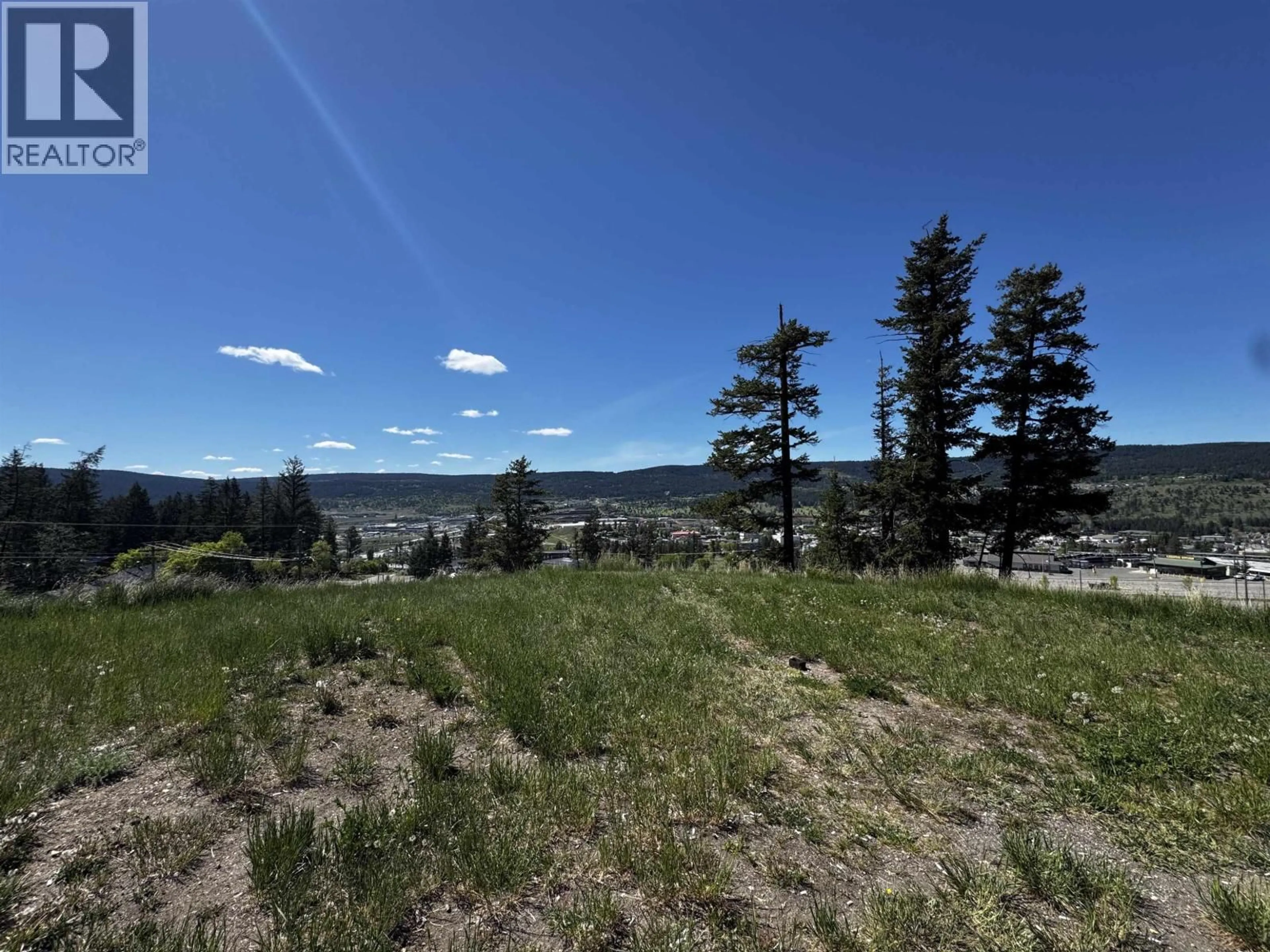 A pic from outside/outdoor area/front of a property/back of a property/a pic from drone, forest/trees view for 308 - 280 BROADWAY AVENUE, Williams Lake British Columbia V2G4J7