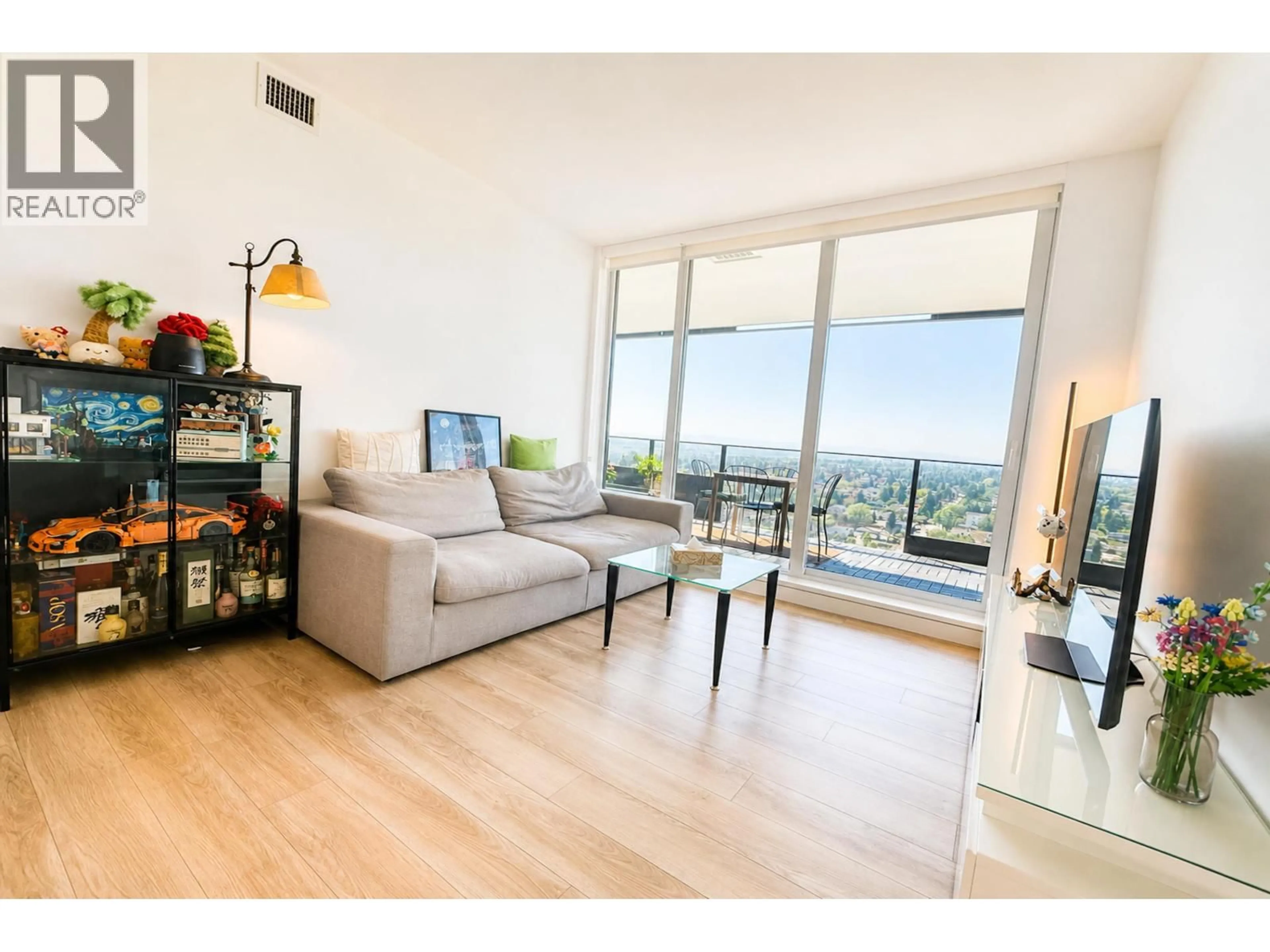 Living room with furniture, wood/laminate floor for 2101 - 6699 DUNBLANE AVENUE, Burnaby British Columbia V5H0J8