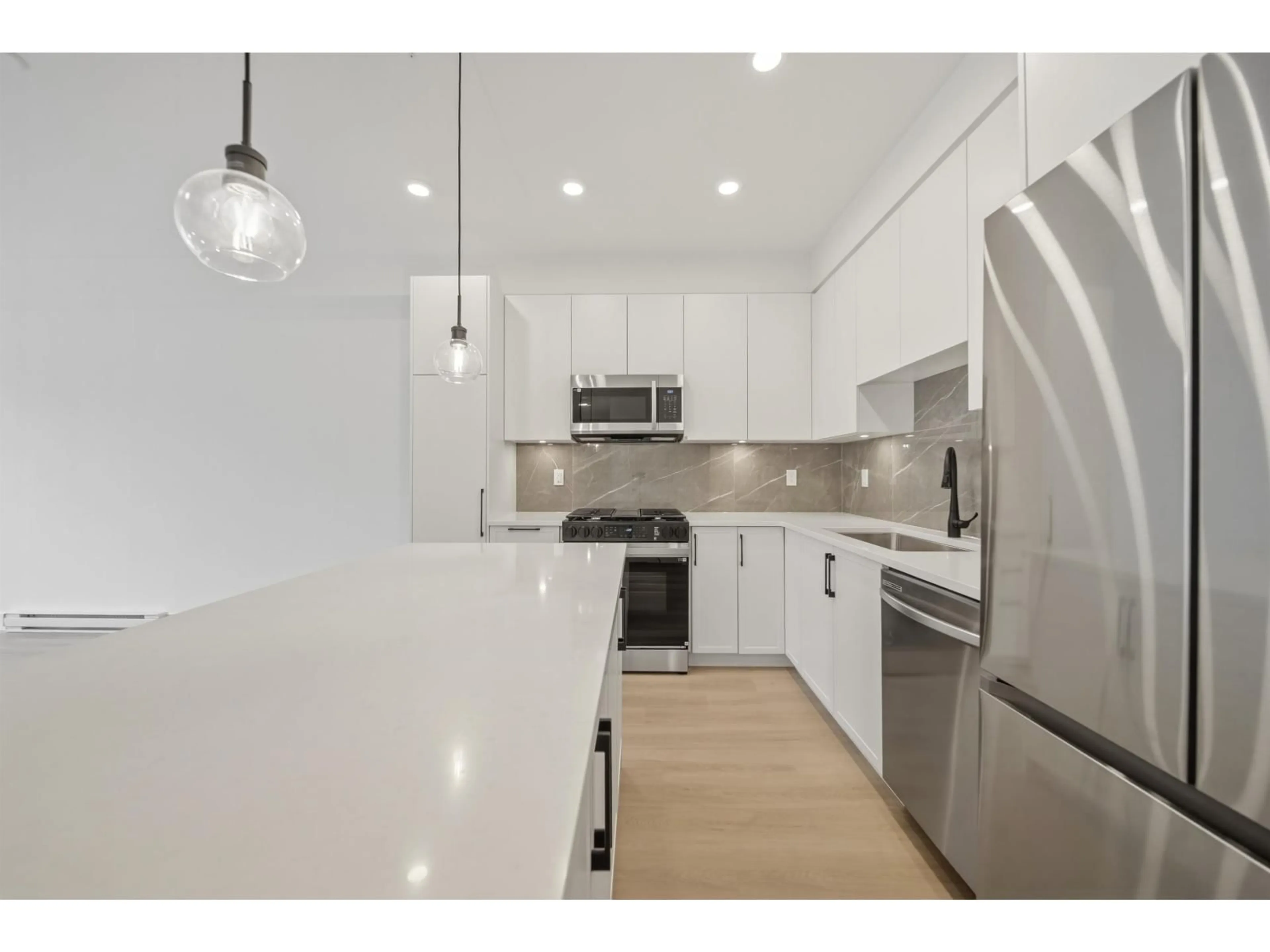 Open concept kitchen, unknown for 401 - 3438 146A STREET, Surrey British Columbia V0V0V0