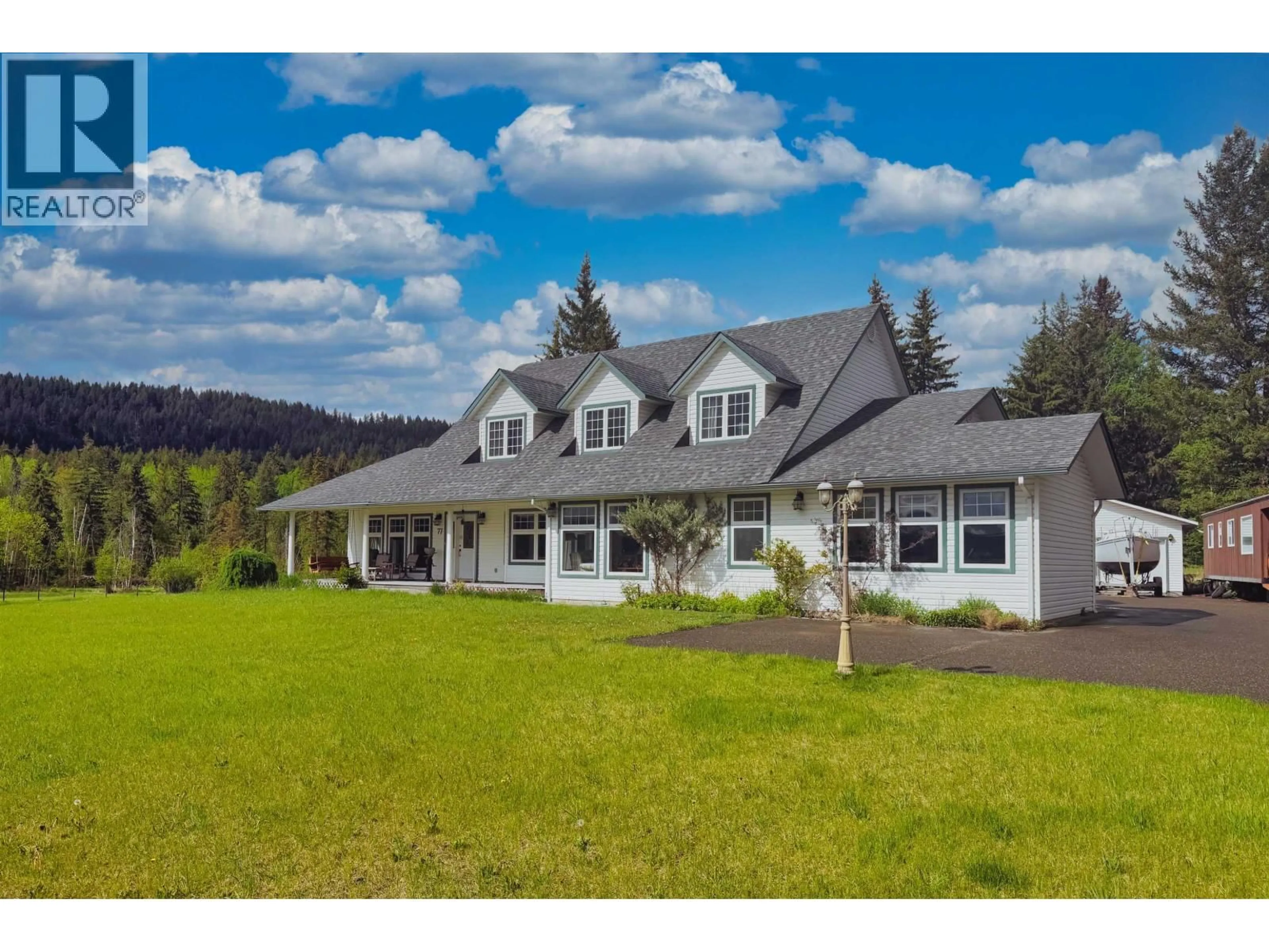 A pic from outside/outdoor area/front of a property/back of a property/a pic from drone, mountain view for 77 WOODLAND DRIVE, Williams Lake British Columbia V2G4P9