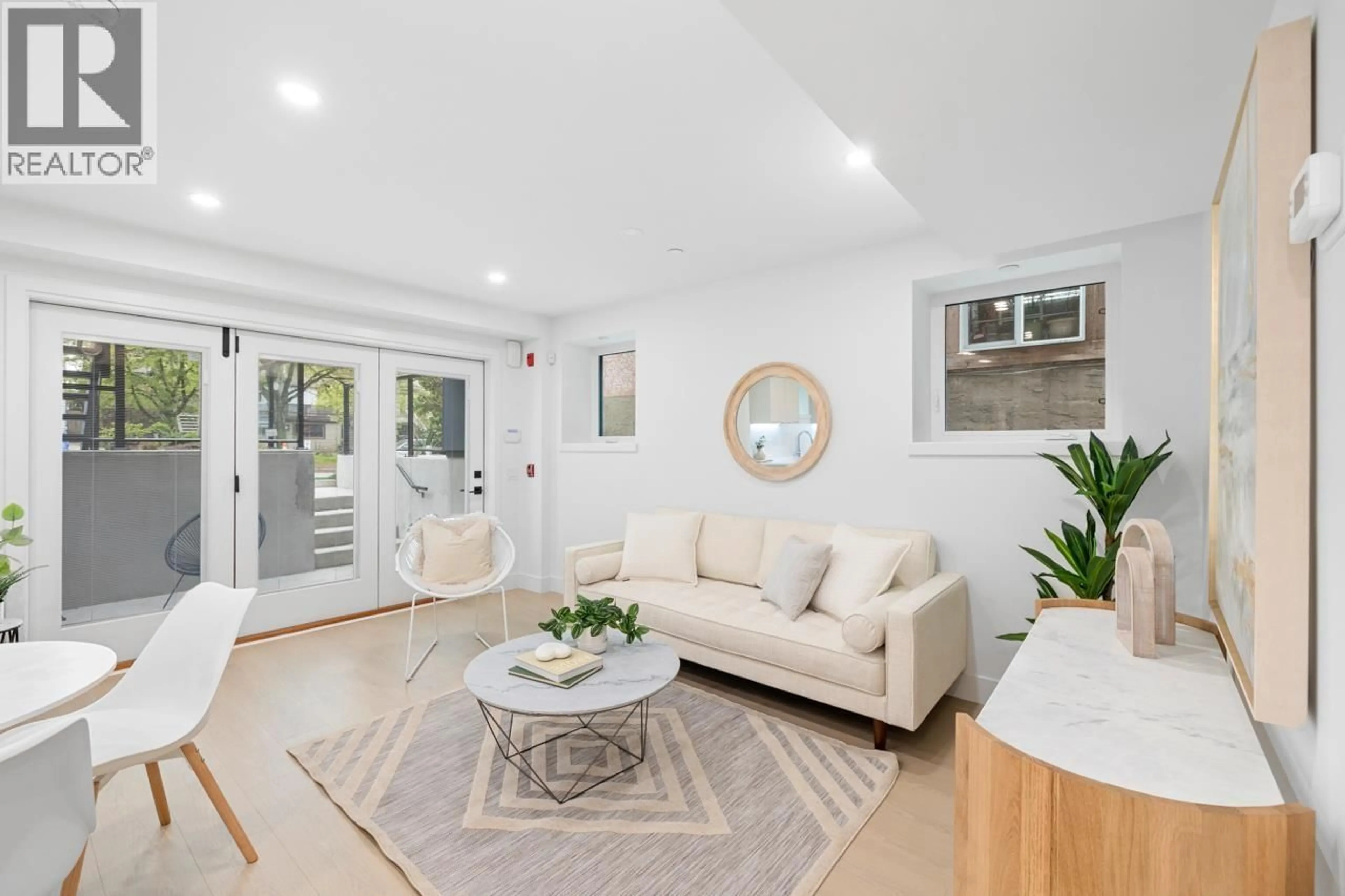 Living room with furniture, unknown for 101 - 2135 PENDER STREET, Vancouver British Columbia V5L1X3