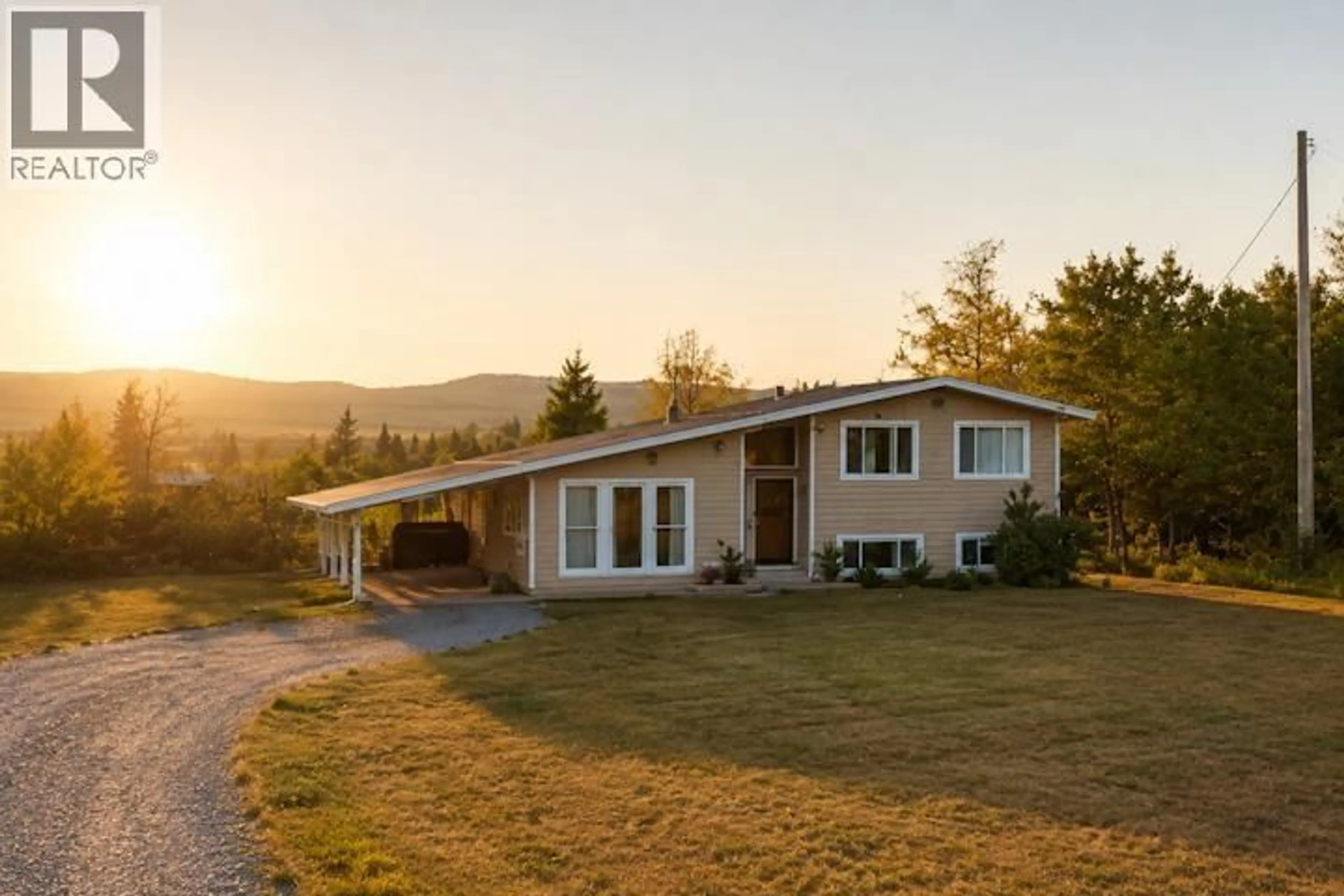 A pic from outside/outdoor area/front of a property/back of a property/a pic from drone, mountain view for 15256 271 ROAD, Fort St. John British Columbia V1J4M6