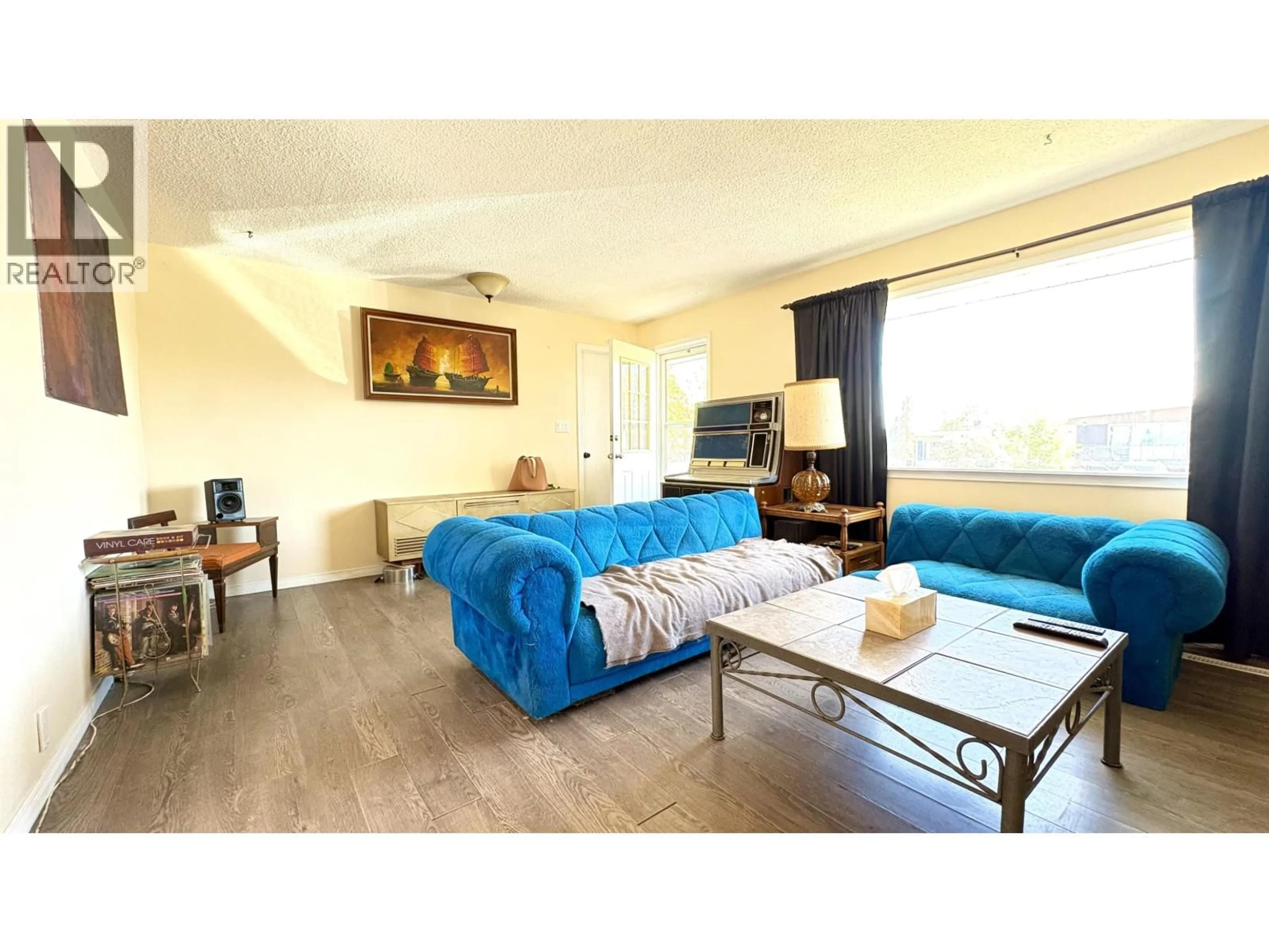 Living room with furniture, wood/laminate floor for 731 HARPER STREET, Prince George British Columbia V2M2W6