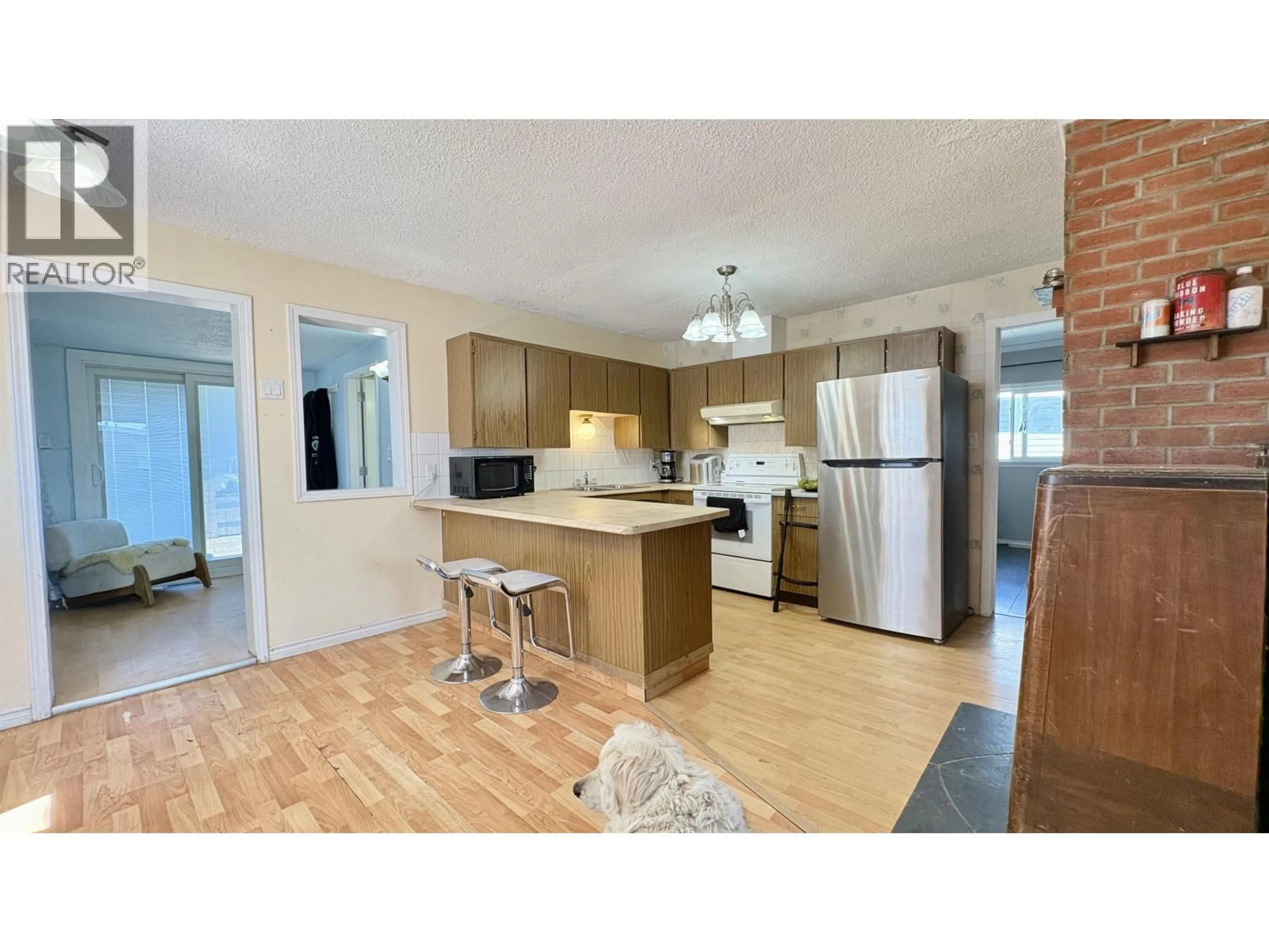 Open concept kitchen, wood/laminate floor for 731 HARPER STREET, Prince George British Columbia V2M2W6