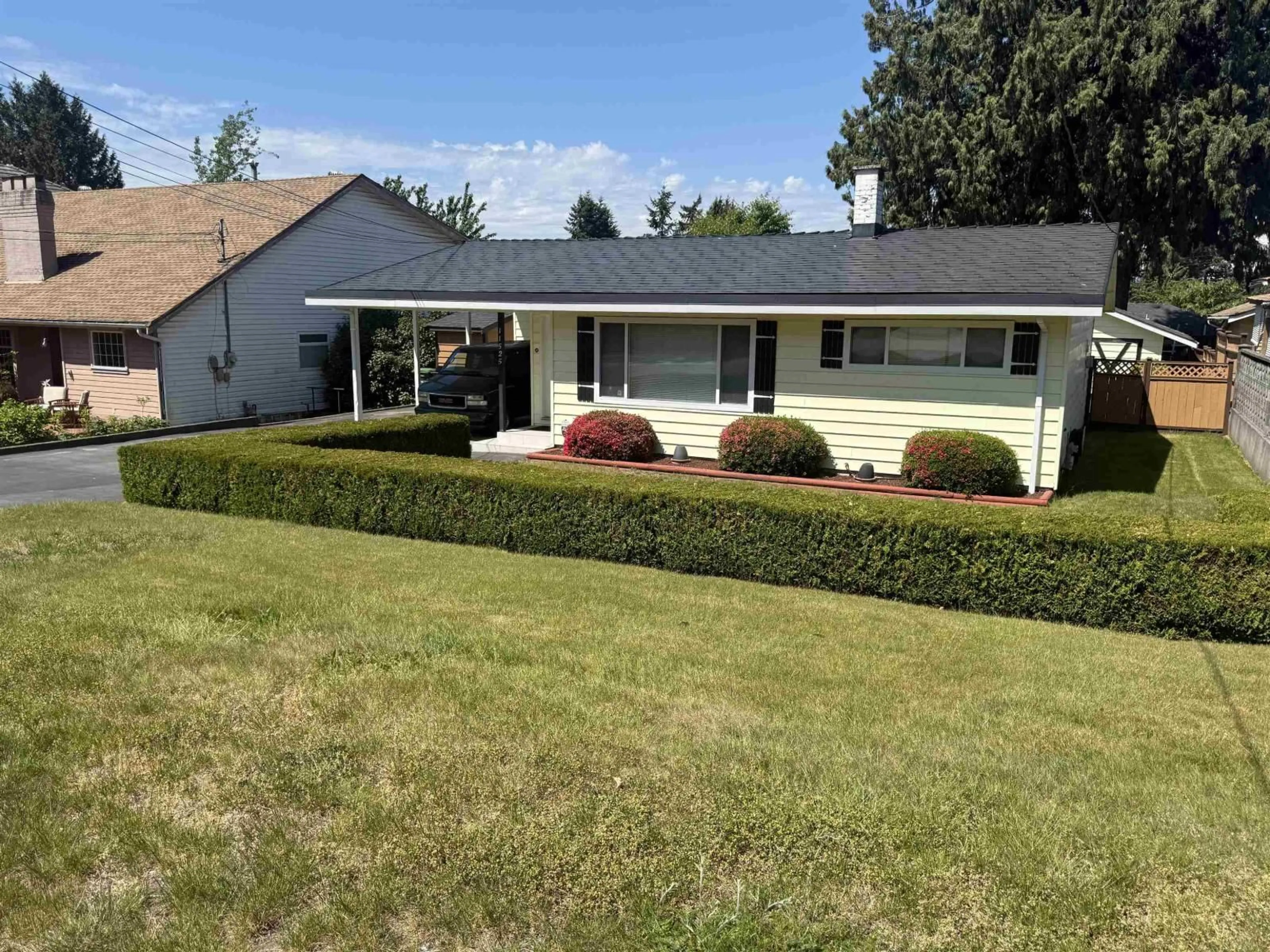 Home with vinyl exterior material, street for 11525 96A AVENUE, Surrey British Columbia V3V1Z9