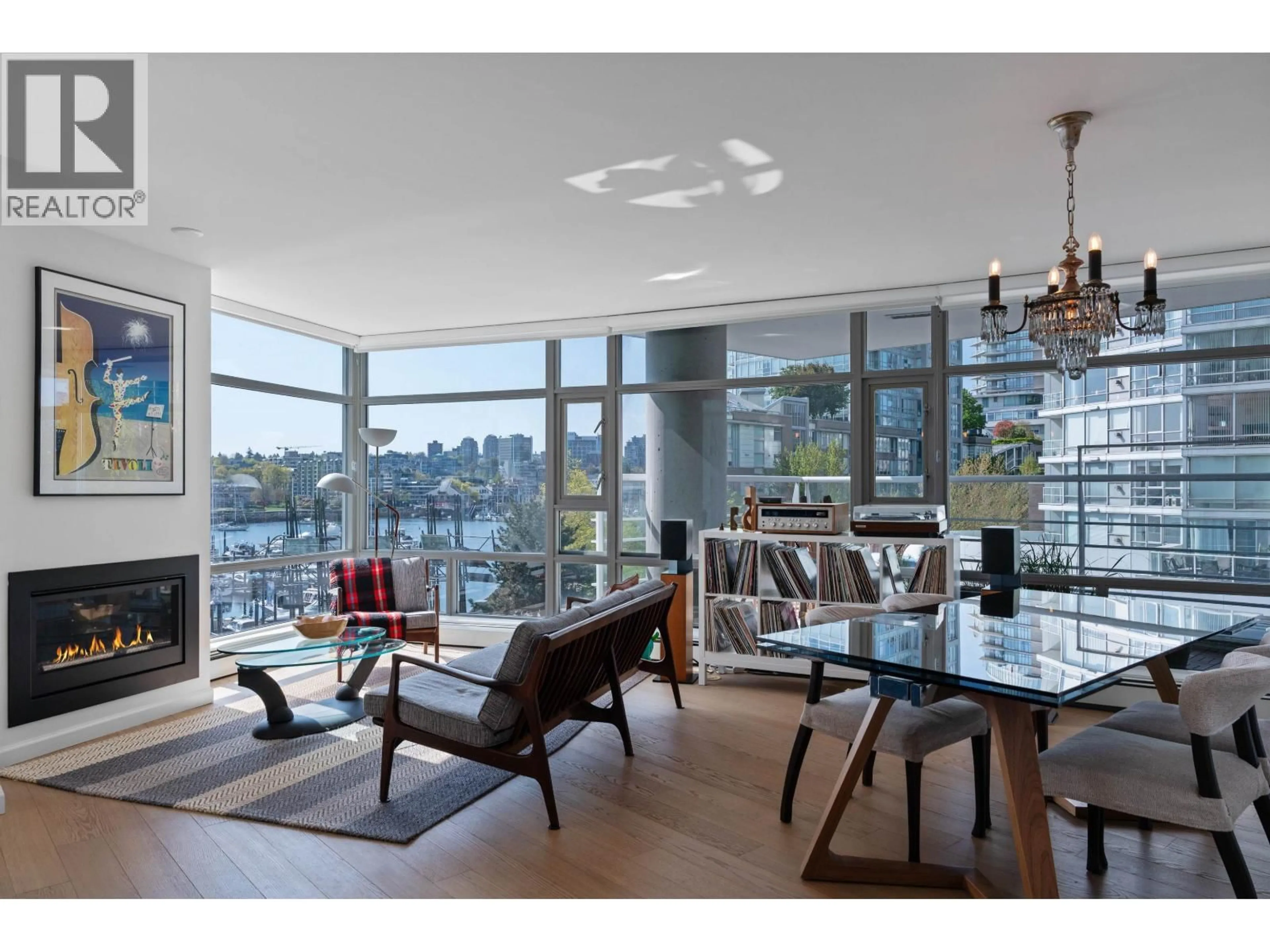 Living room with furniture, wood/laminate floor for 501 - 1199 MARINASIDE CRESCENT, Vancouver British Columbia V6Z2Y2