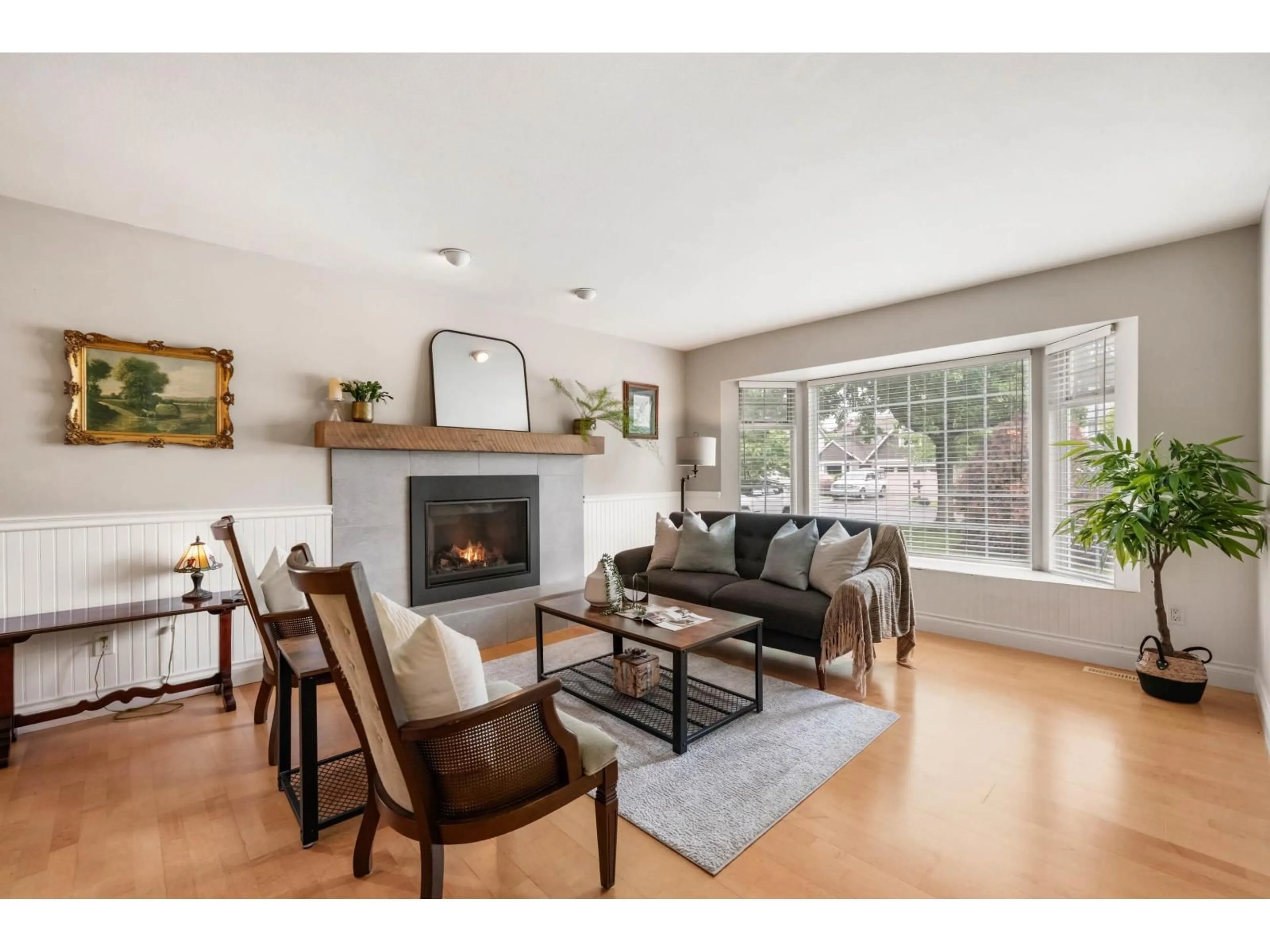 Living room with furniture, wood/laminate floor for 27136 25A AVENUE, Langley British Columbia V4W3N4