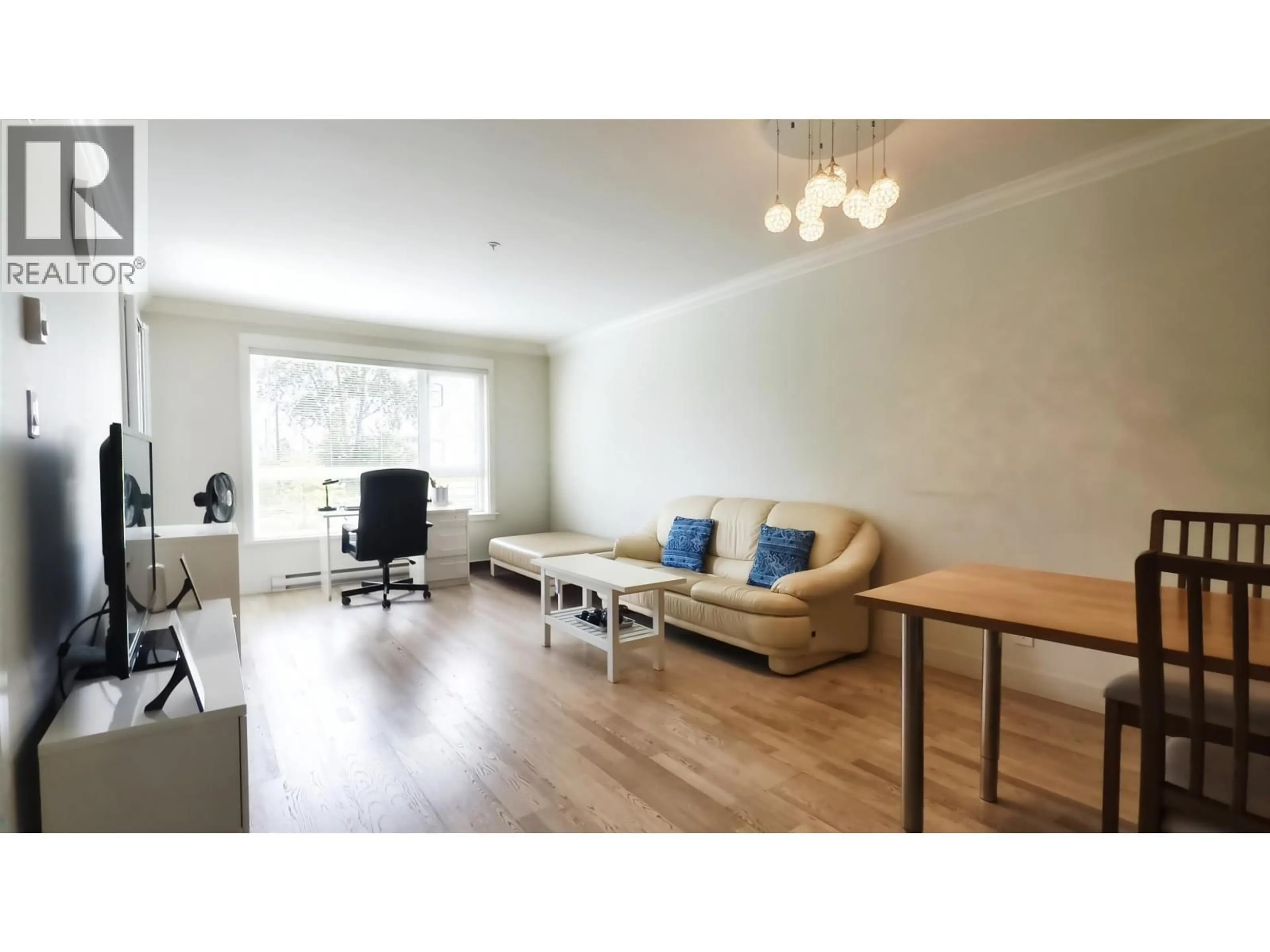 Living room with furniture, wood/laminate floor for 209 - 7058 14TH AVENUE, Burnaby British Columbia V3N0E6