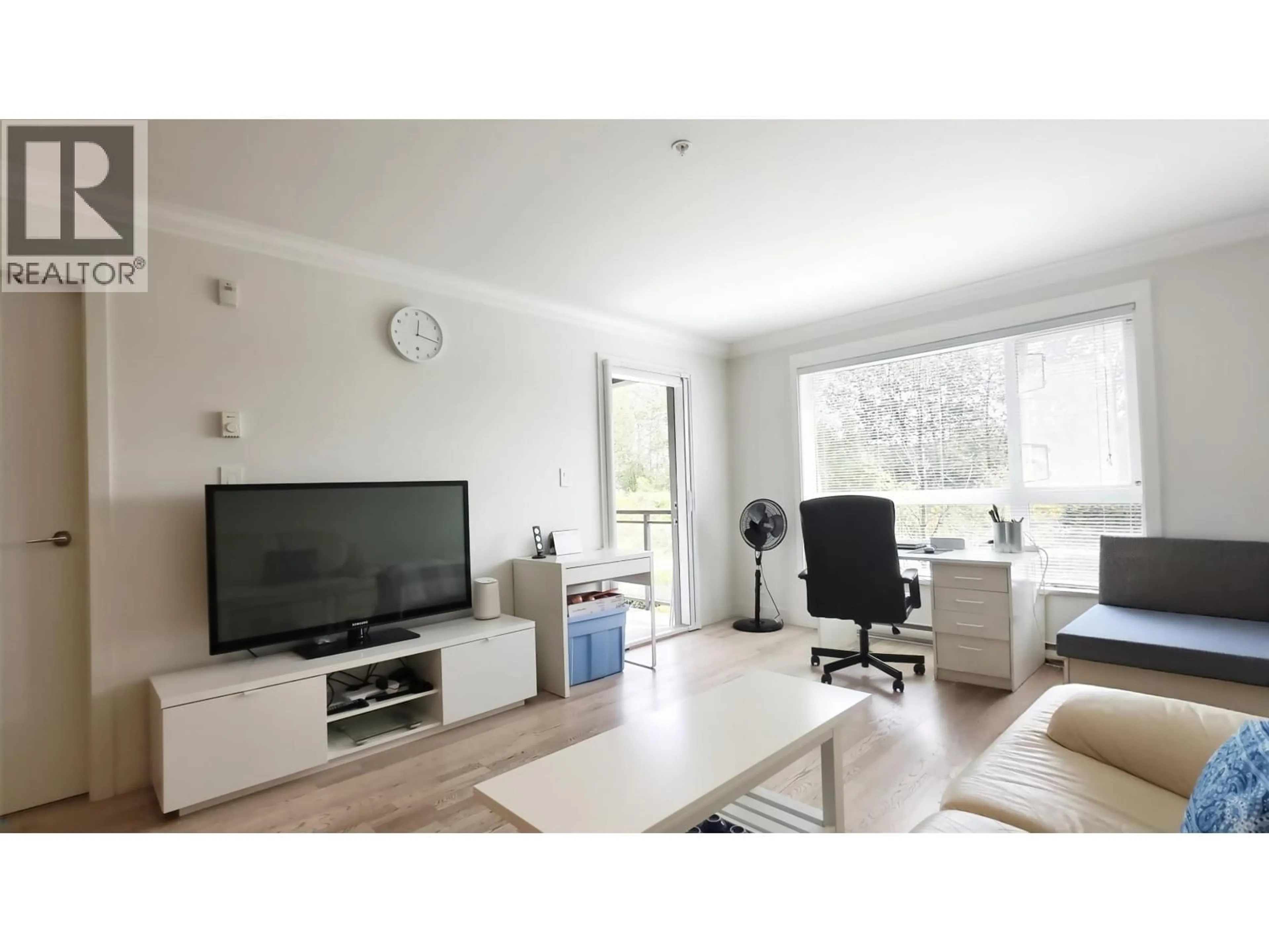 Living room with furniture, wood/laminate floor for 209 - 7058 14TH AVENUE, Burnaby British Columbia V3N0E6