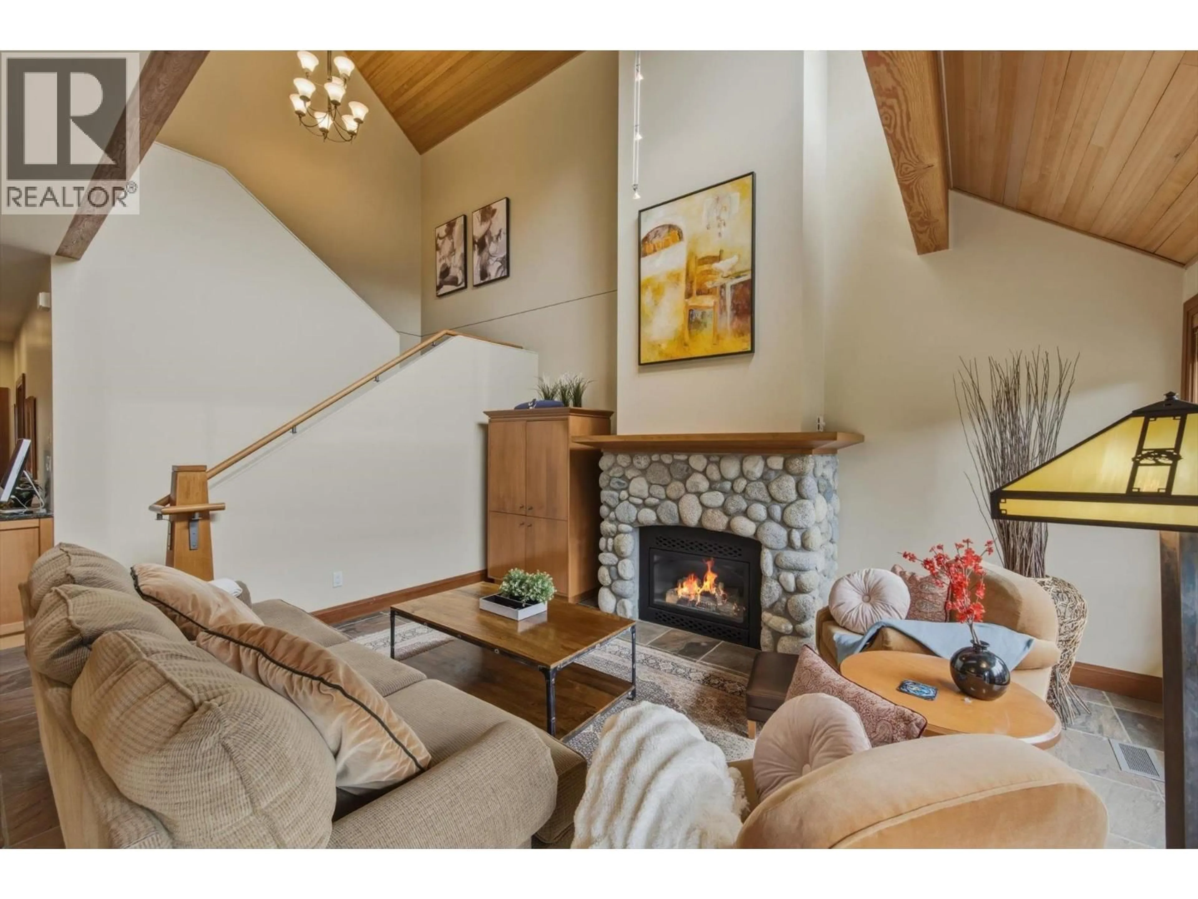 Living room with furniture, wood/laminate floor for 4824 CASABELLA CRESCENT, Whistler British Columbia V8E0Z4