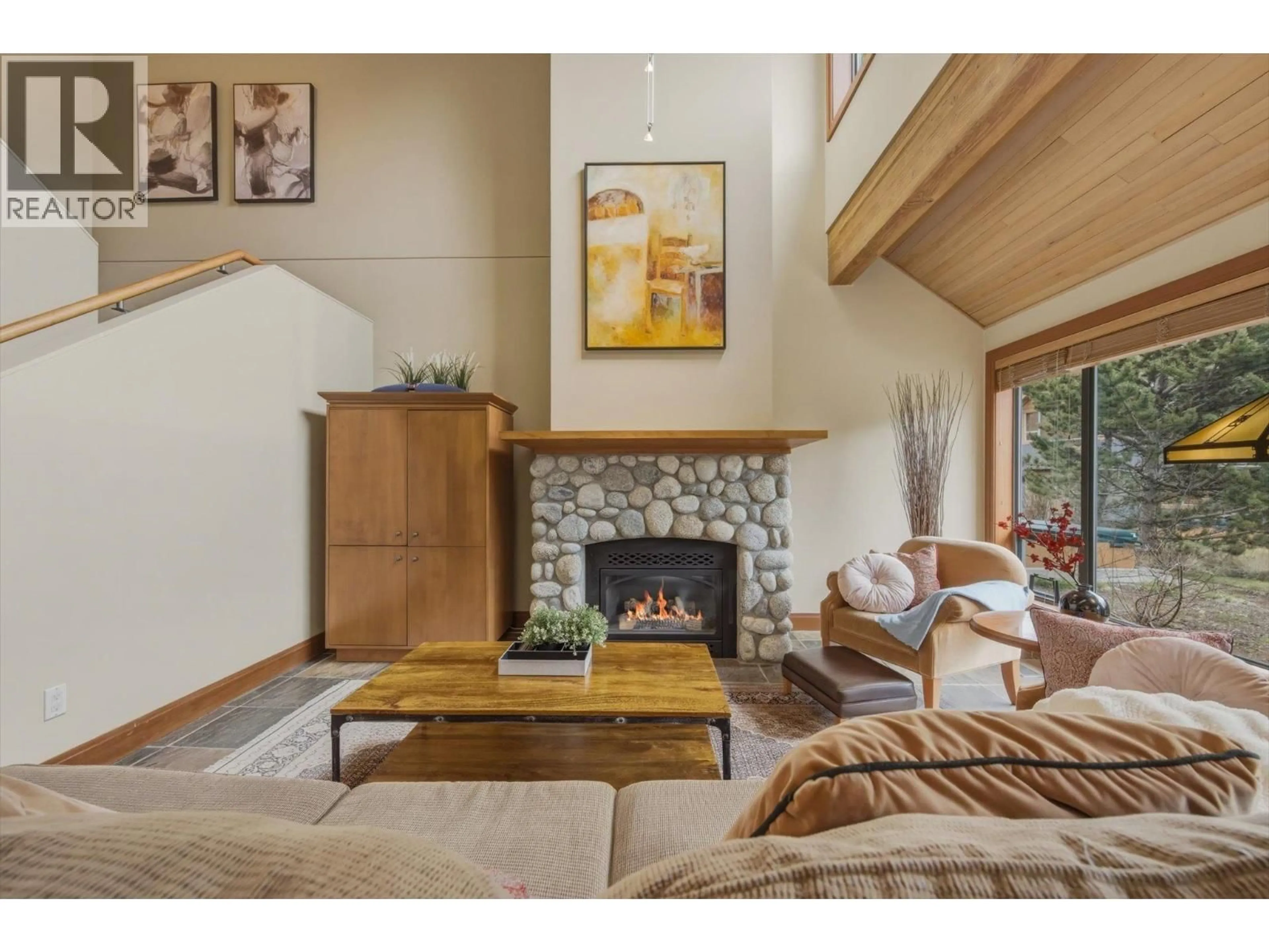 Living room with furniture, wood/laminate floor for 4824 CASABELLA CRESCENT, Whistler British Columbia V8E0Z4
