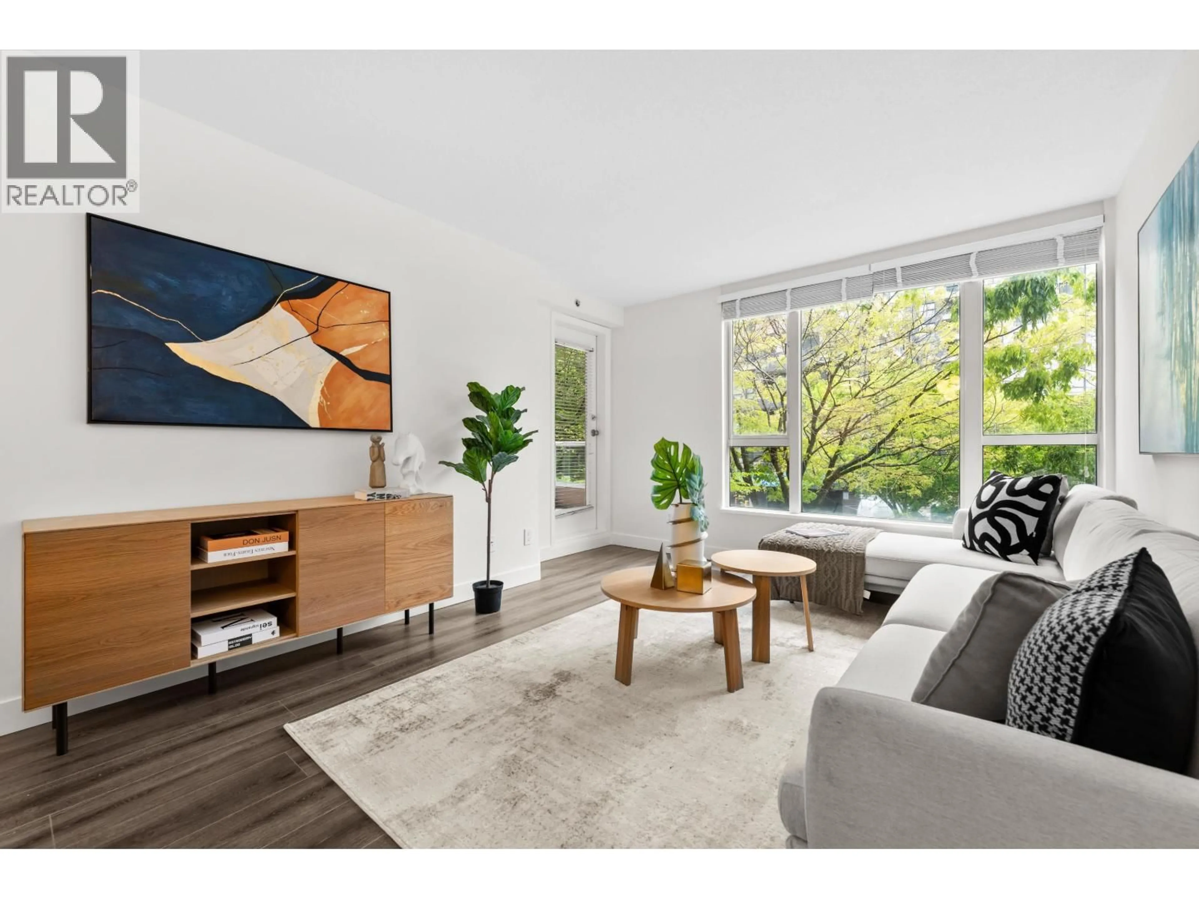 Living room with furniture, unknown for 201 - 5189 GASTON STREET, Vancouver British Columbia V5R6C7