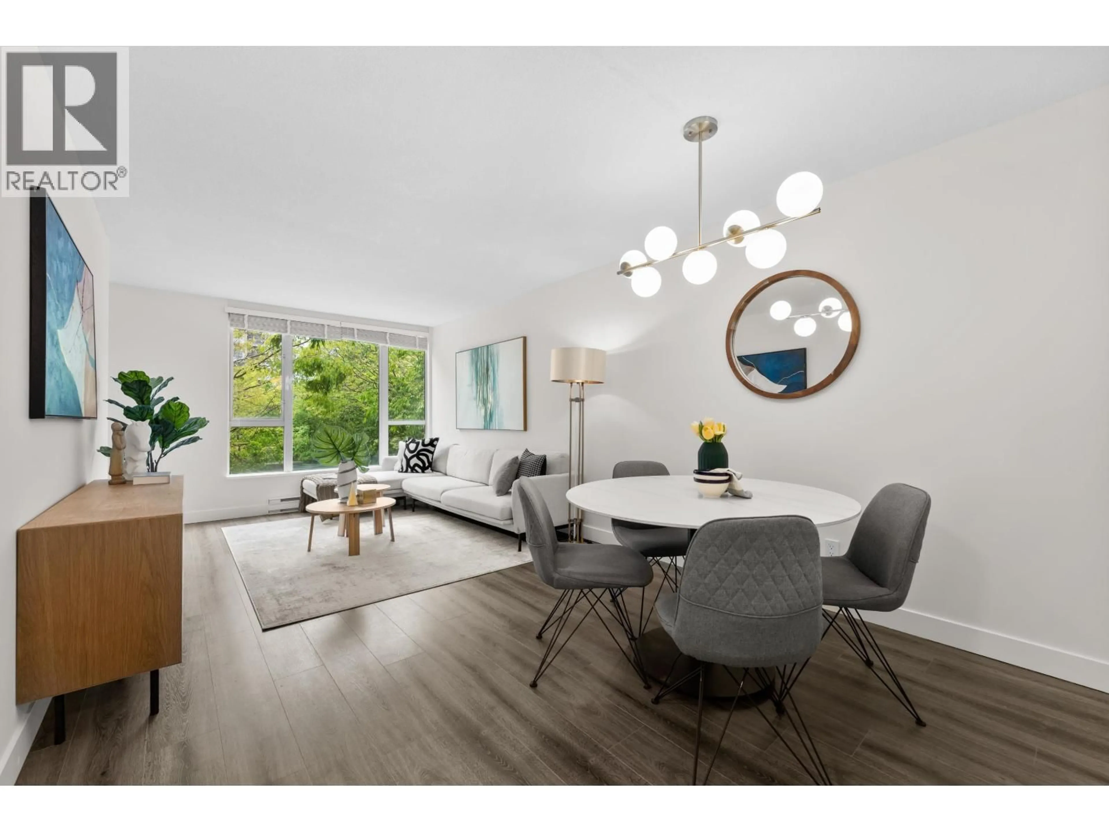 Dining room, wood/laminate floor for 201 - 5189 GASTON STREET, Vancouver British Columbia V5R6C7
