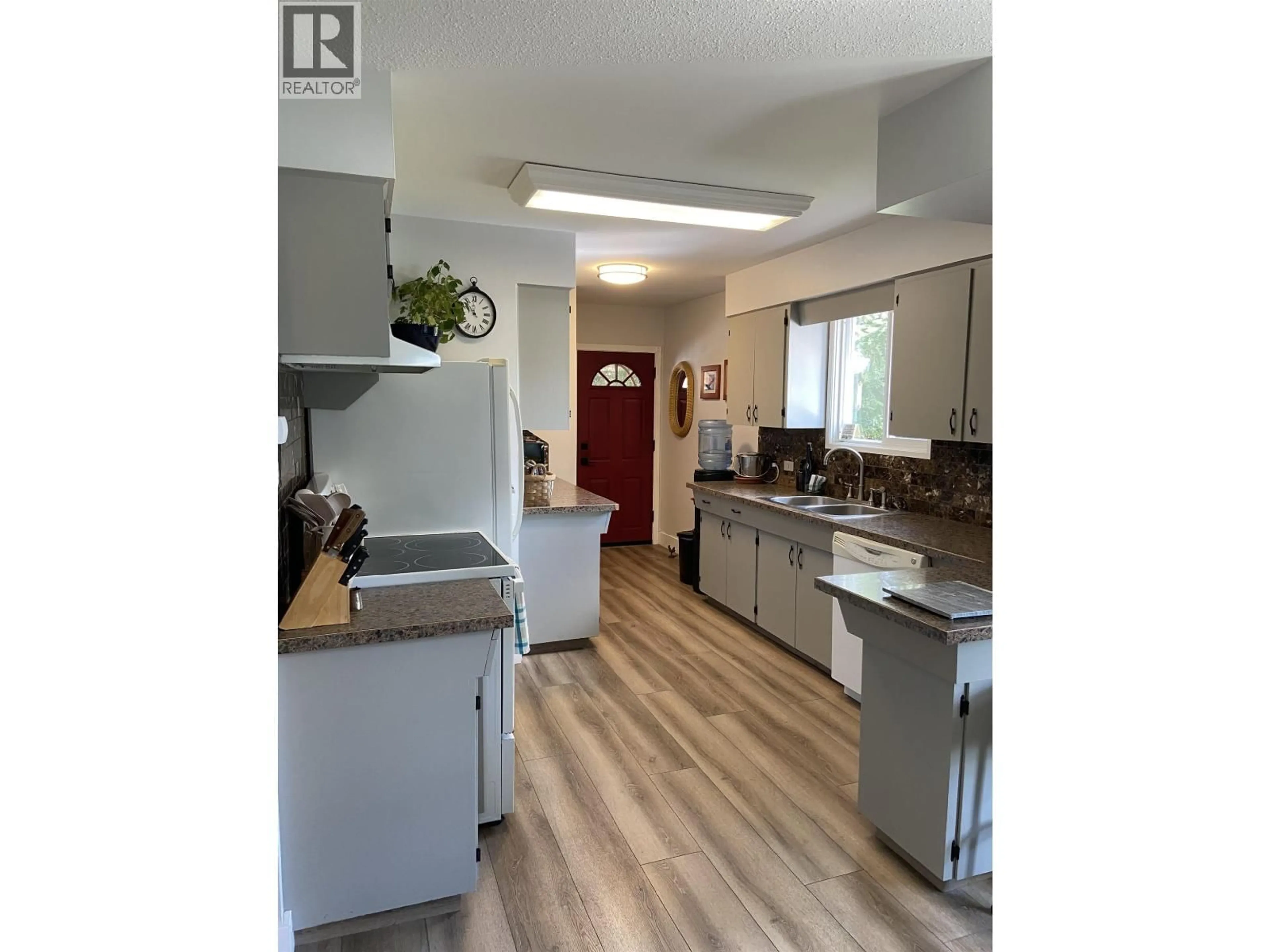 Open concept kitchen, wood/laminate floor for 4012 MUNROE STREET, Terrace British Columbia V8G3C5