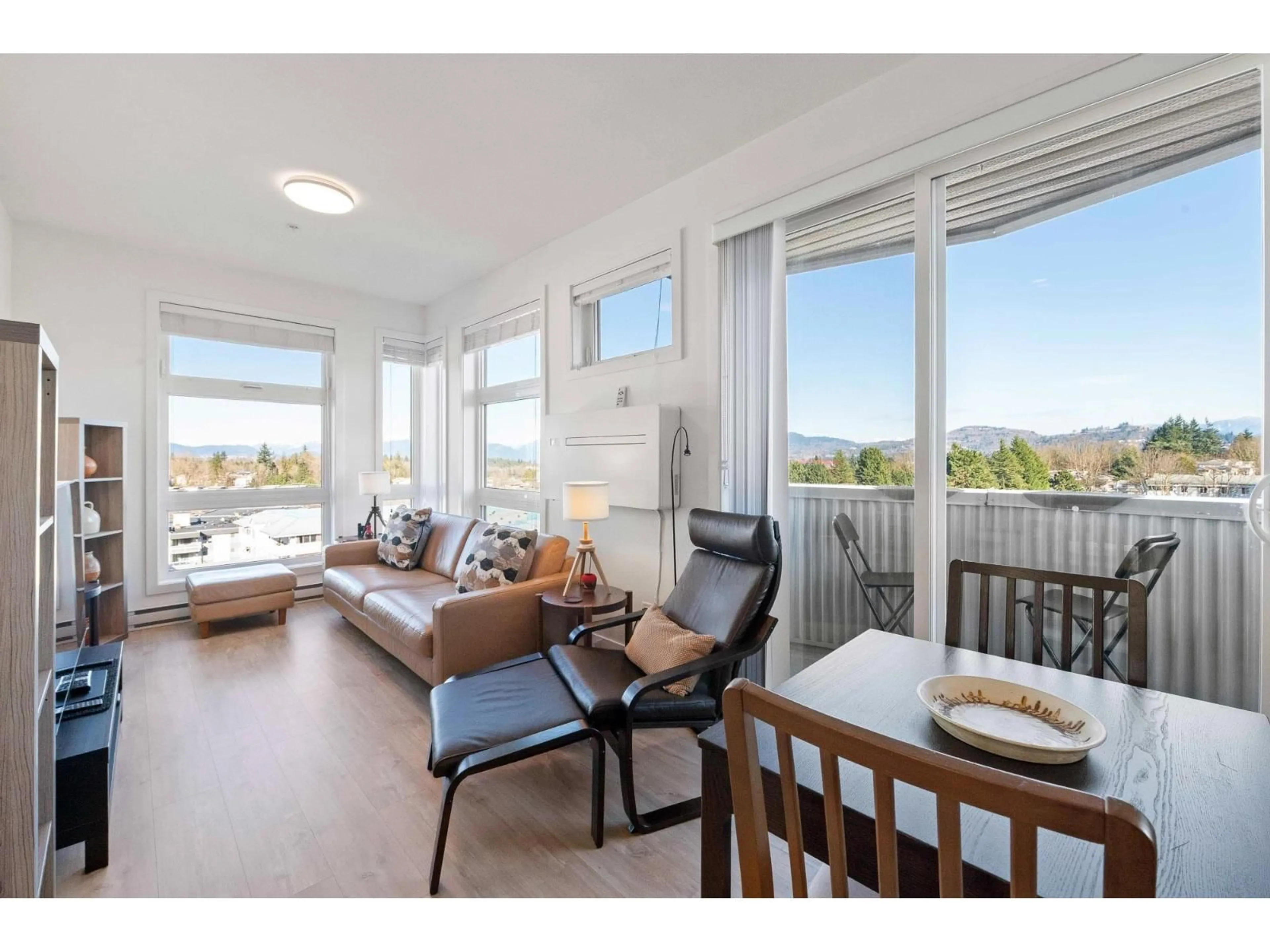 Living room with furniture, wood/laminate floor for 601 - 32838 LANDEAU PLACE, Abbotsford British Columbia V2S0M6