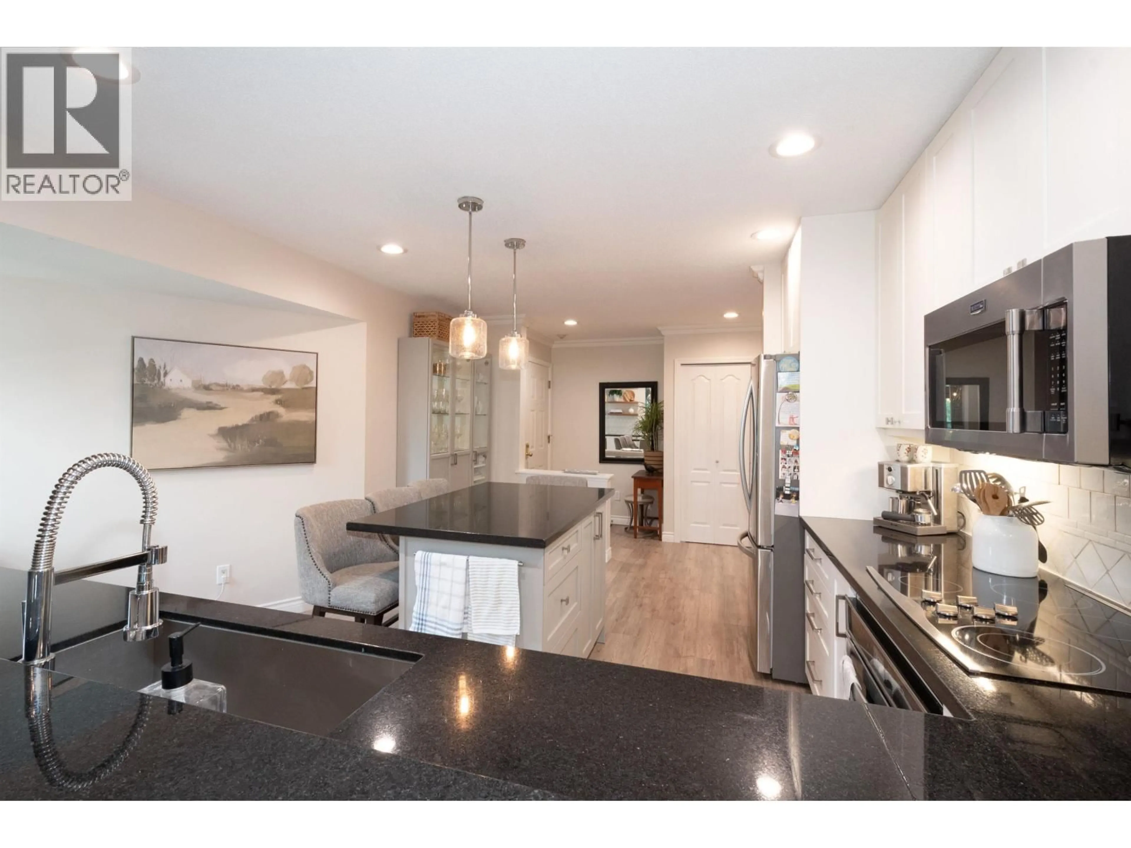 Open concept kitchen, unknown for 706 - 1500 OSTLER COURT, North Vancouver British Columbia V7G2S2