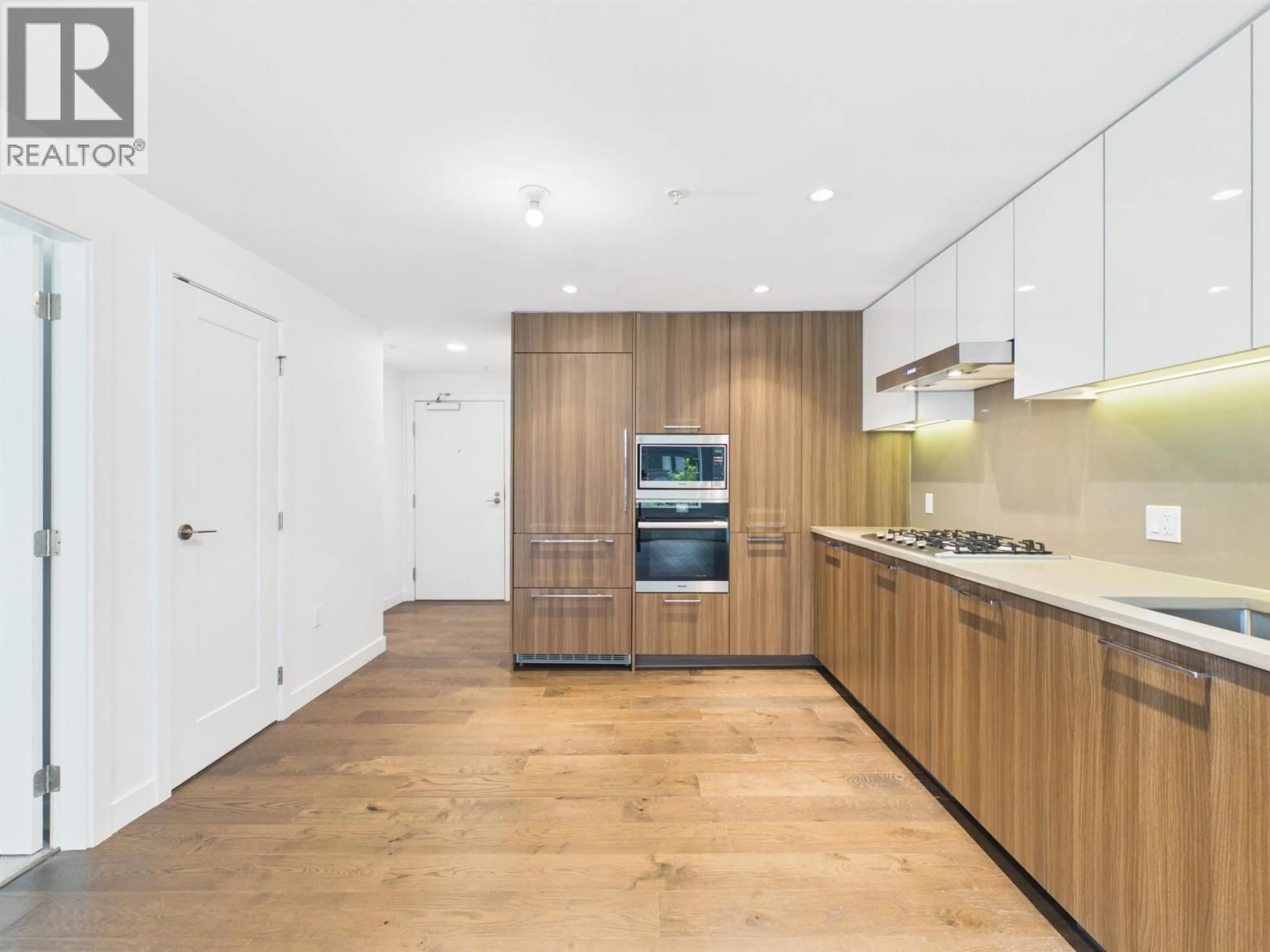 Open concept kitchen, wood/laminate floor for 612 - 8160 MCMYN WAY, Richmond British Columbia V6X0T9