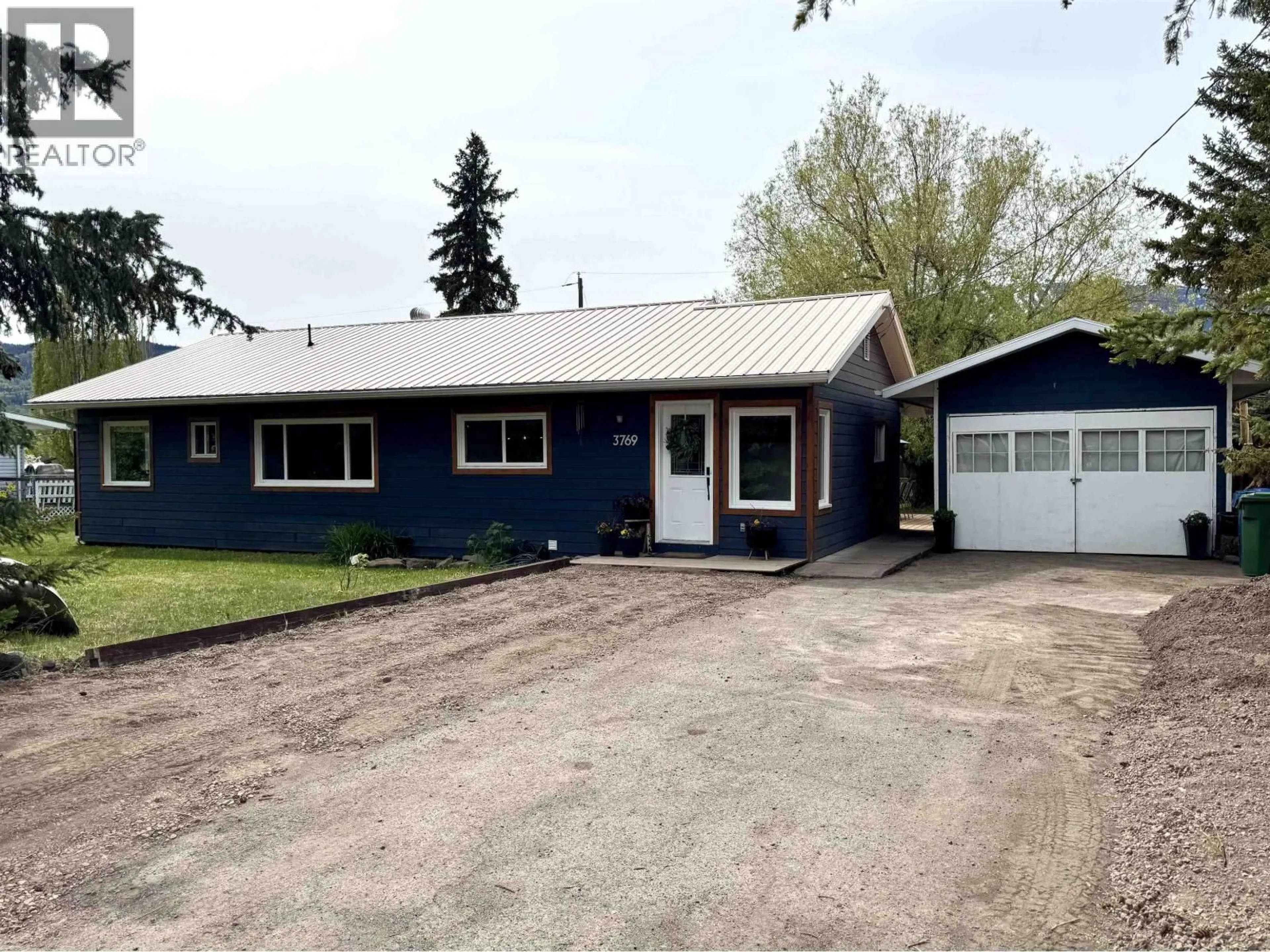 Home with vinyl exterior material, street for 3769 15TH AVENUE, Smithers British Columbia V0J2N0
