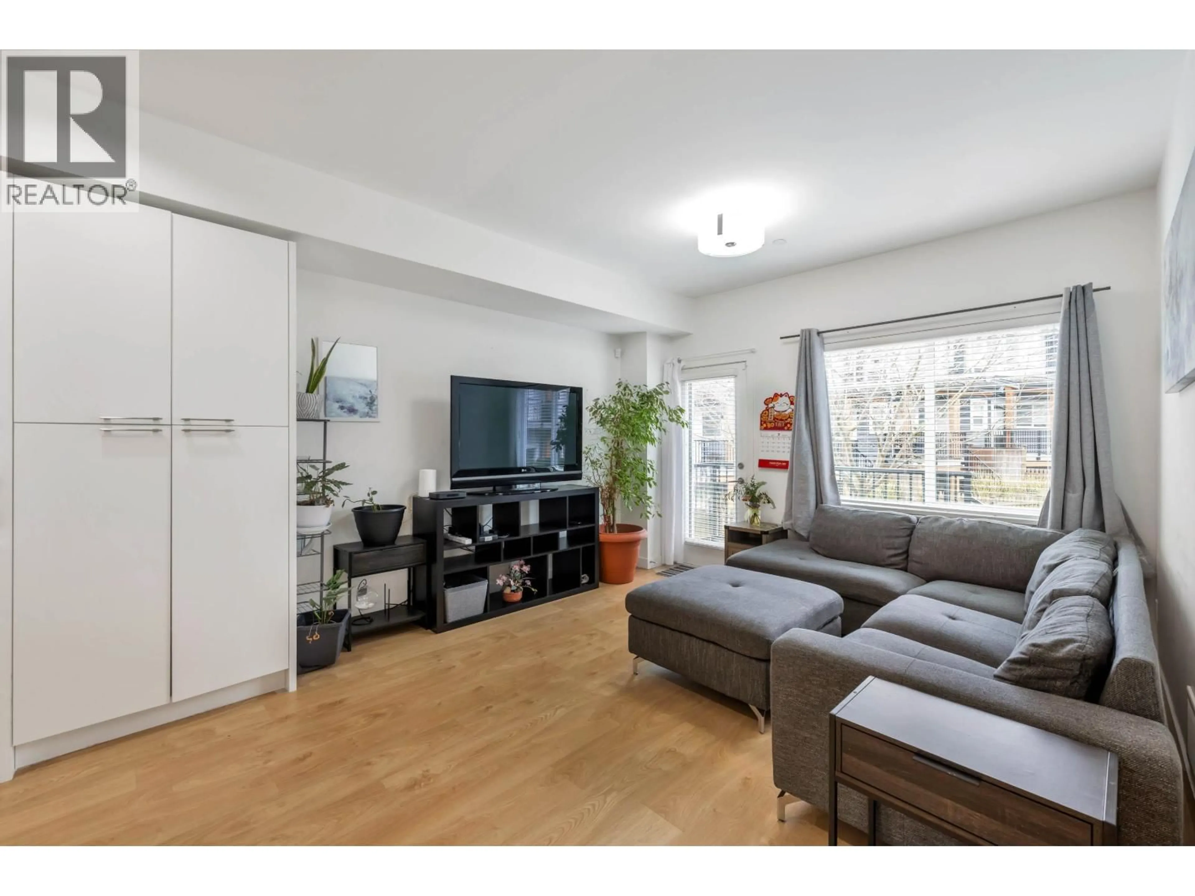 Living room with furniture, wood/laminate floor for 22 - 22810 113 AVENUE, Maple Ridge British Columbia V2X3N2