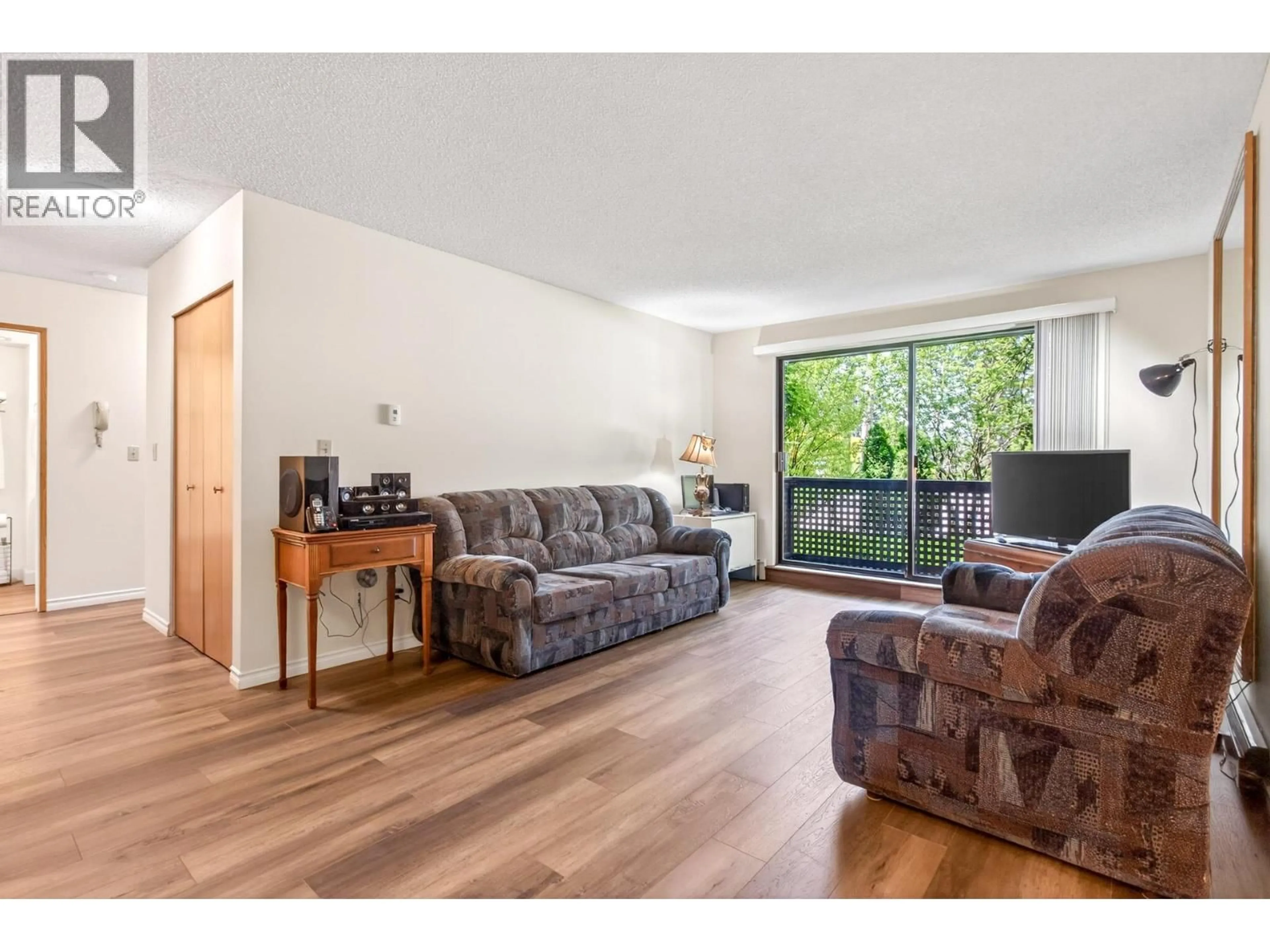 Living room with furniture, wood/laminate floor for 115 - 535 BLUE MOUNTAIN STREET, Coquitlam British Columbia V3J4R2