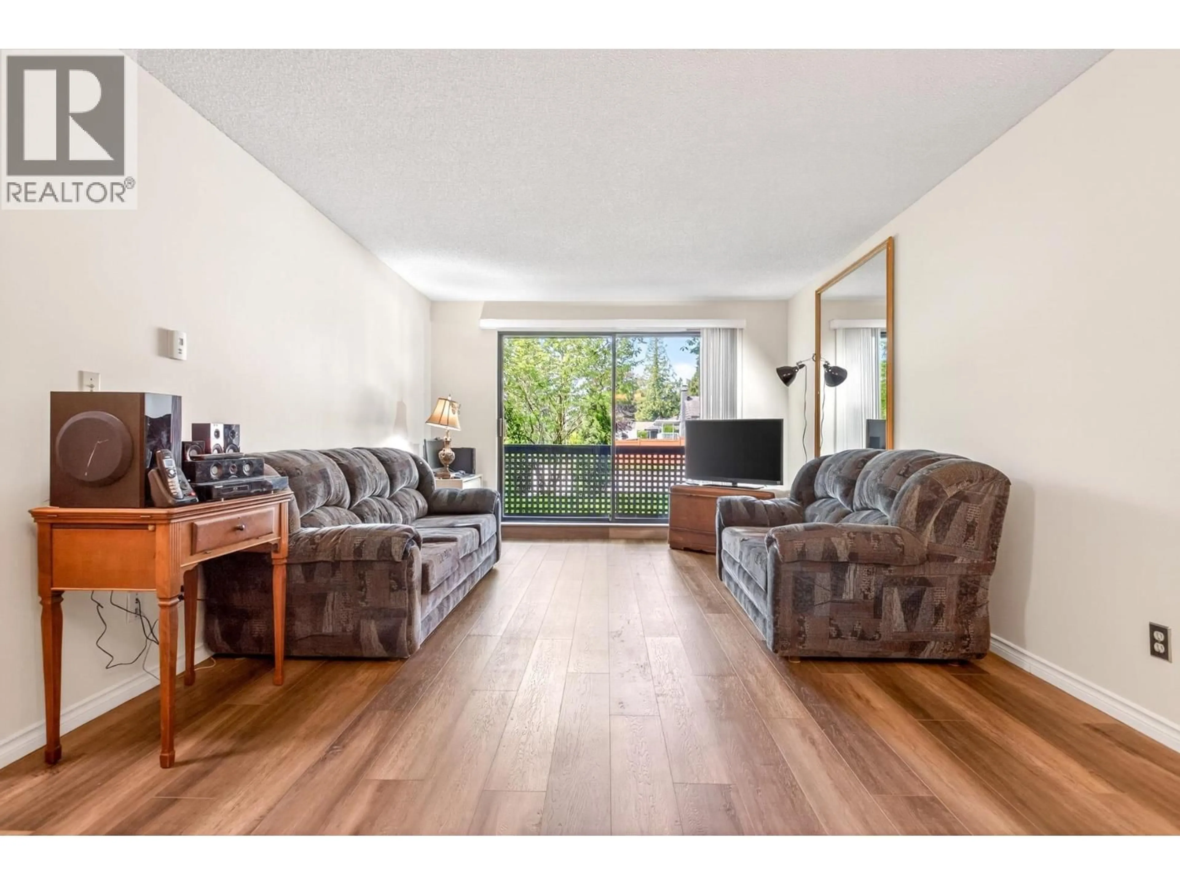 Living room with furniture, wood/laminate floor for 115 - 535 BLUE MOUNTAIN STREET, Coquitlam British Columbia V3J4R2