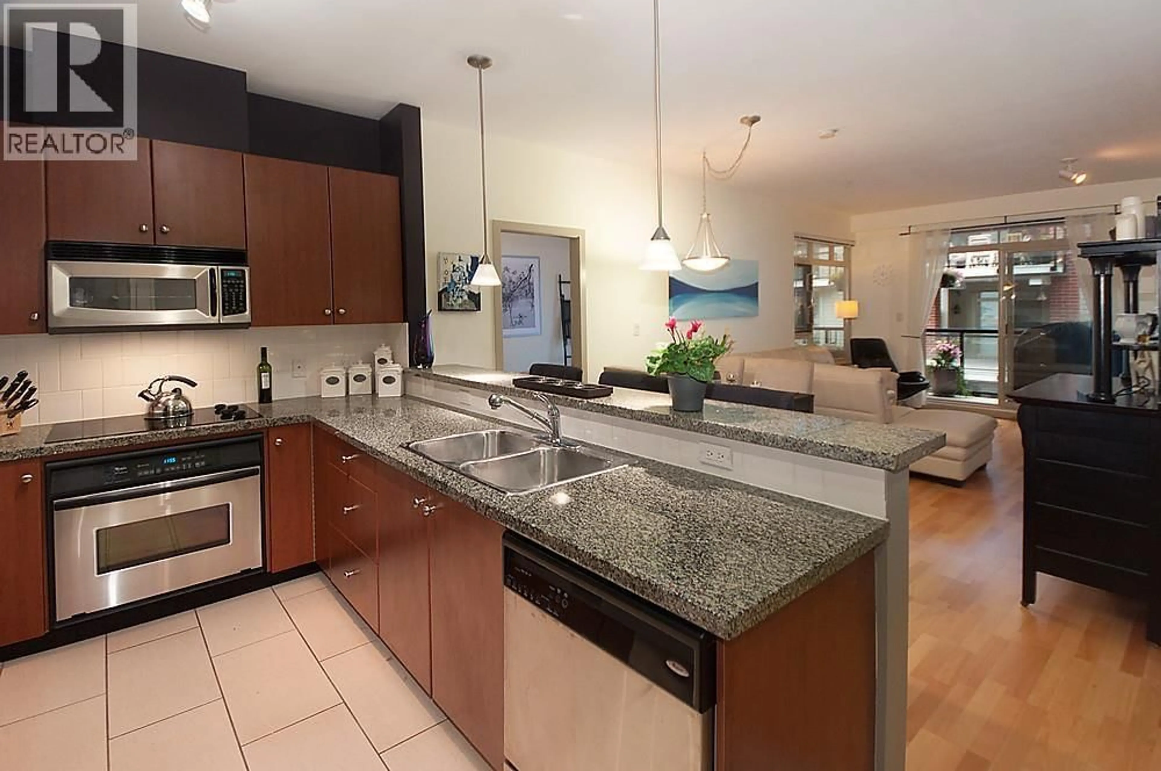 Open concept kitchen, ceramic/tile floor for 202 - 200 CAPILANO ROAD, Port Moody British Columbia V3H5N1