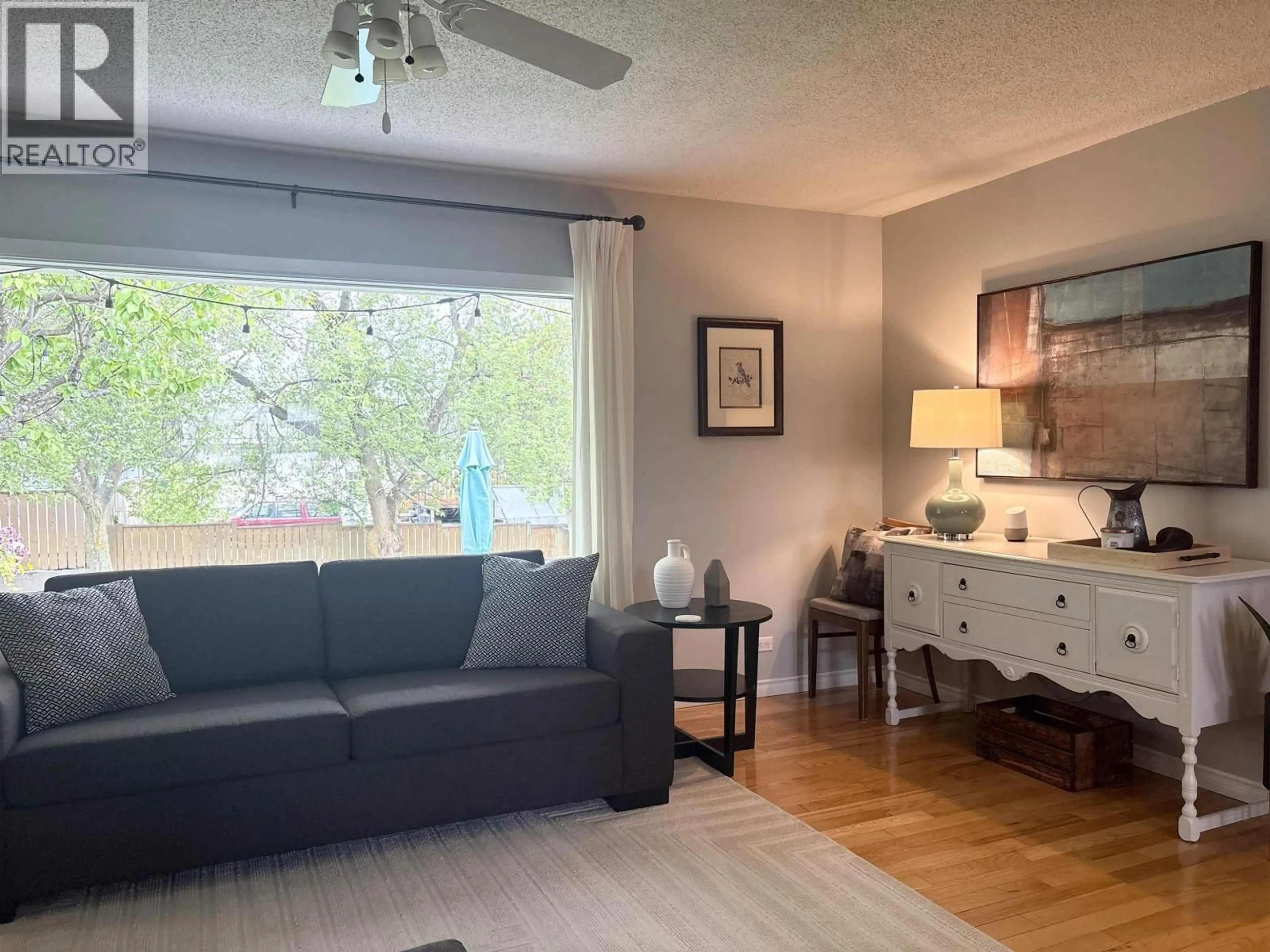 Living room with furniture, wood/laminate floor for 1115 MCGREGOR AVENUE, Prince George British Columbia V2M4A8