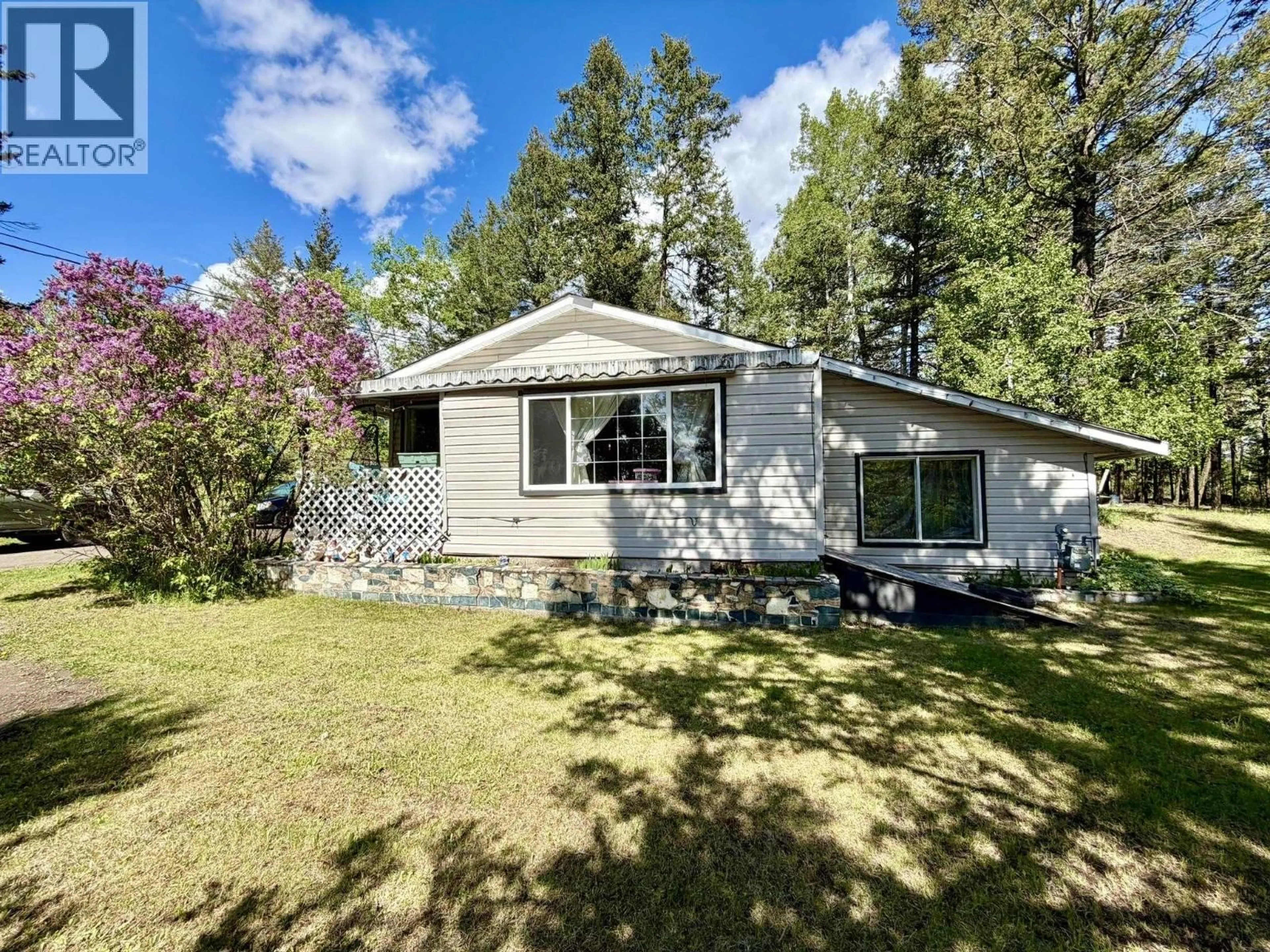 A pic from outside/outdoor area/front of a property/back of a property/a pic from drone, unknown for 4833 TELQUA DRIVE, 108 Mile Ranch British Columbia V0K2Z0
