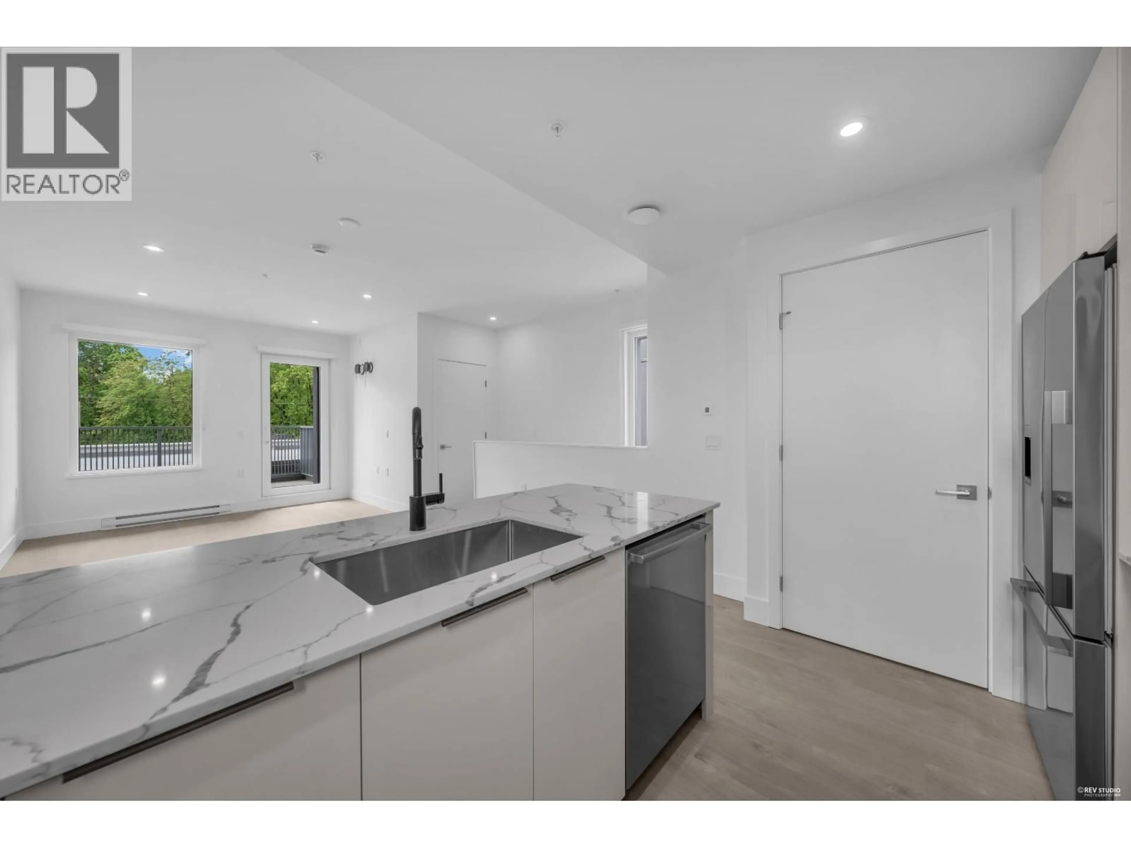 Open concept kitchen, ceramic/tile floor for 309 - 2250 1ST AVENUE, Vancouver British Columbia V5N1B6