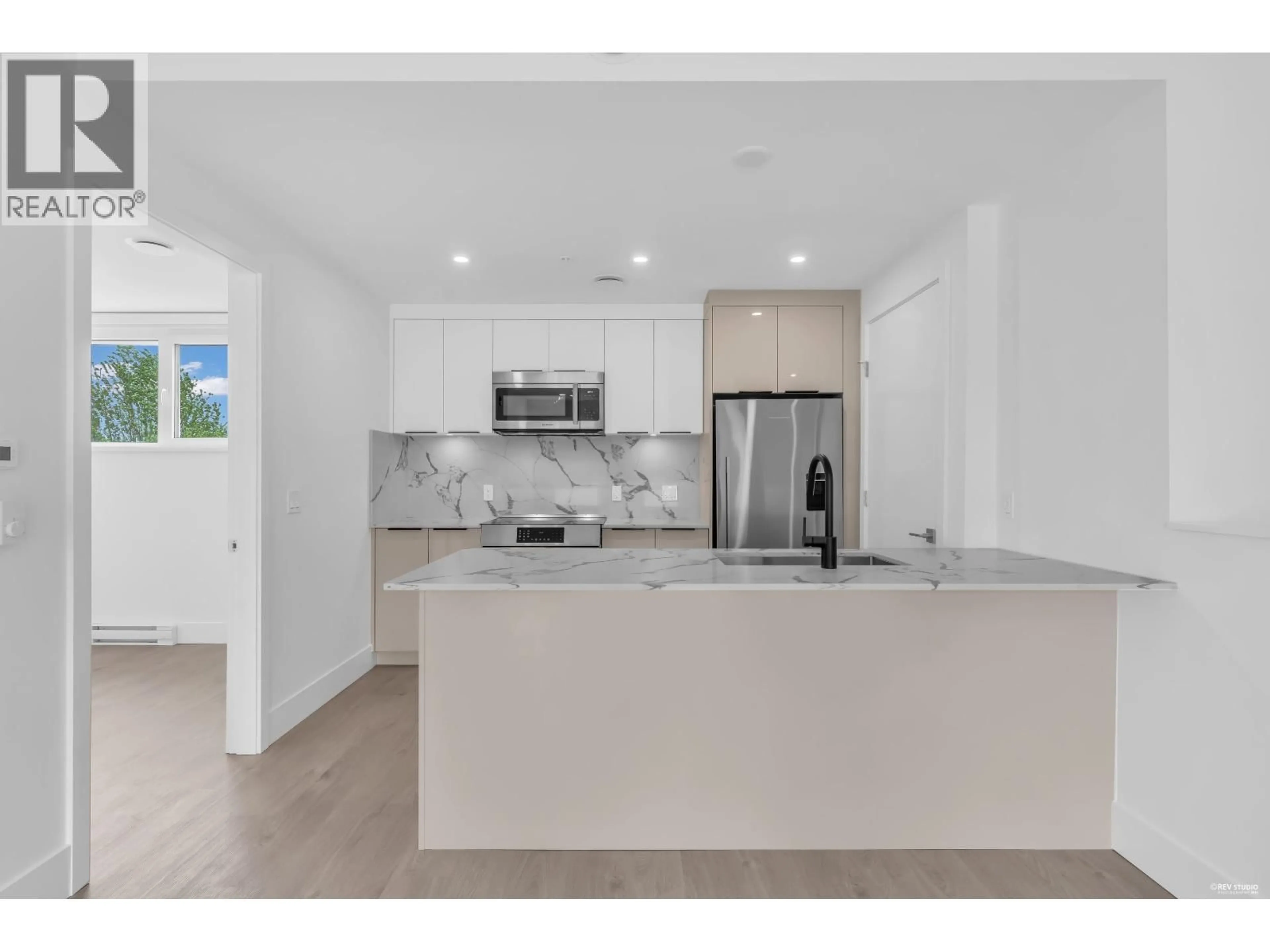 Open concept kitchen, ceramic/tile floor for 315 - 2250 1ST AVENUE, Vancouver British Columbia V5N1B6