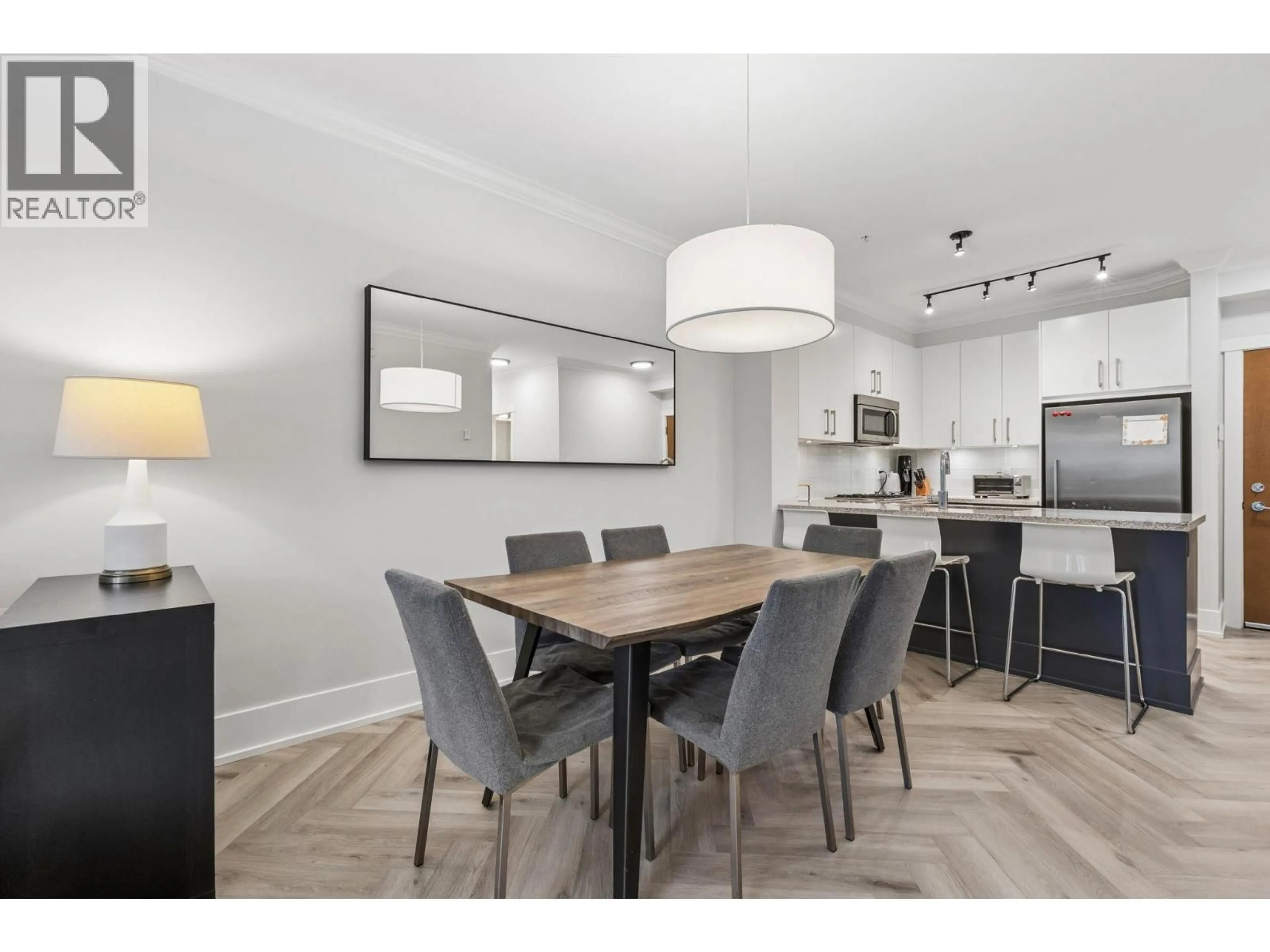 Open concept kitchen, wood/laminate floor for 107 - 159 22ND STREET, North Vancouver British Columbia V7M0B6
